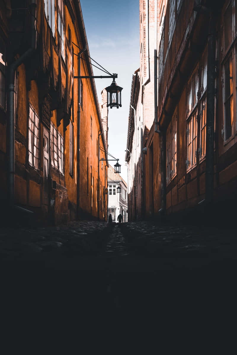 alleyway, cobblestone alleyway, tall orange buildings, SD Phone Wallpaper