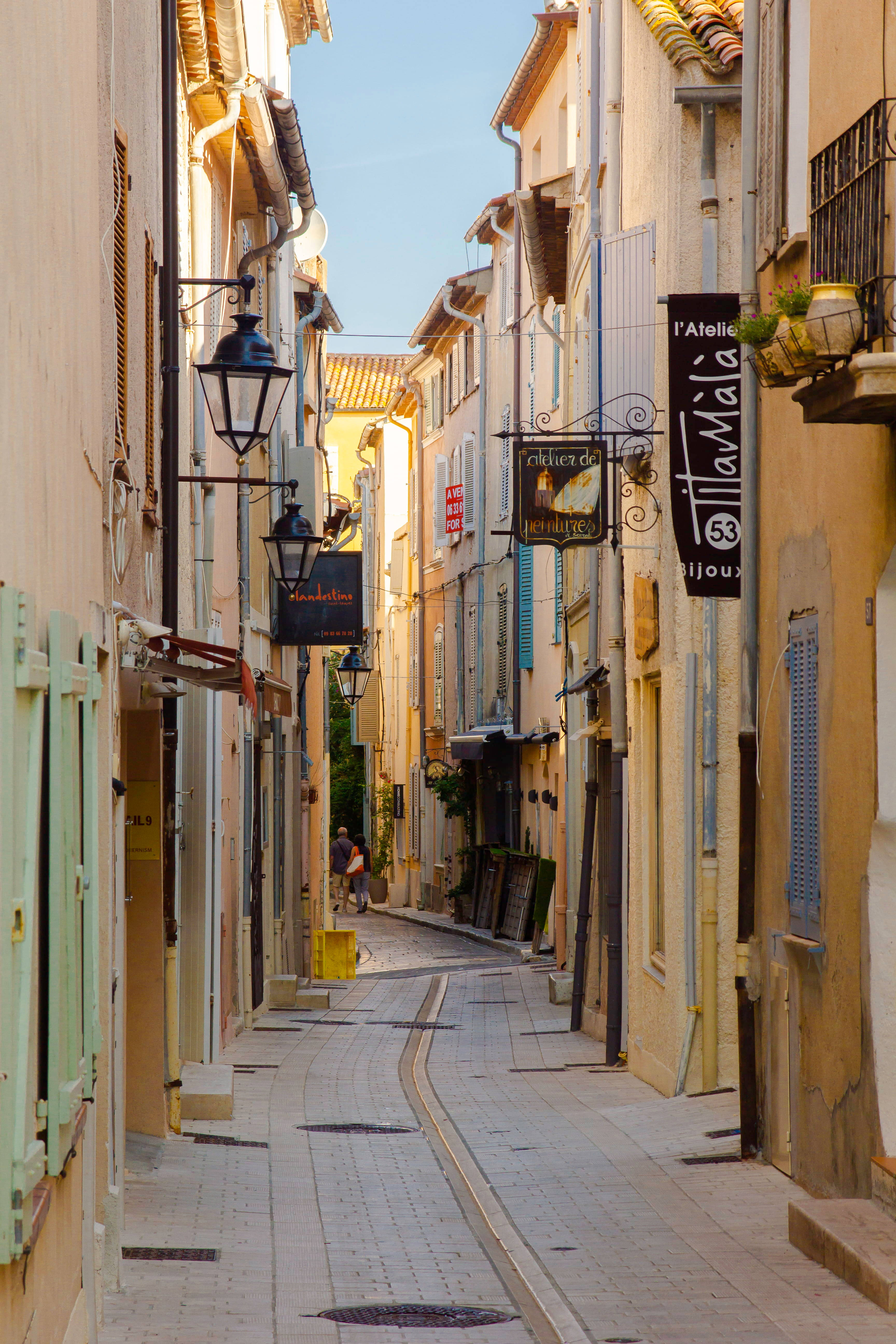 Mediterranean alley, pastel buildings, hanging lanterns, 5K Phone Wallpaper
