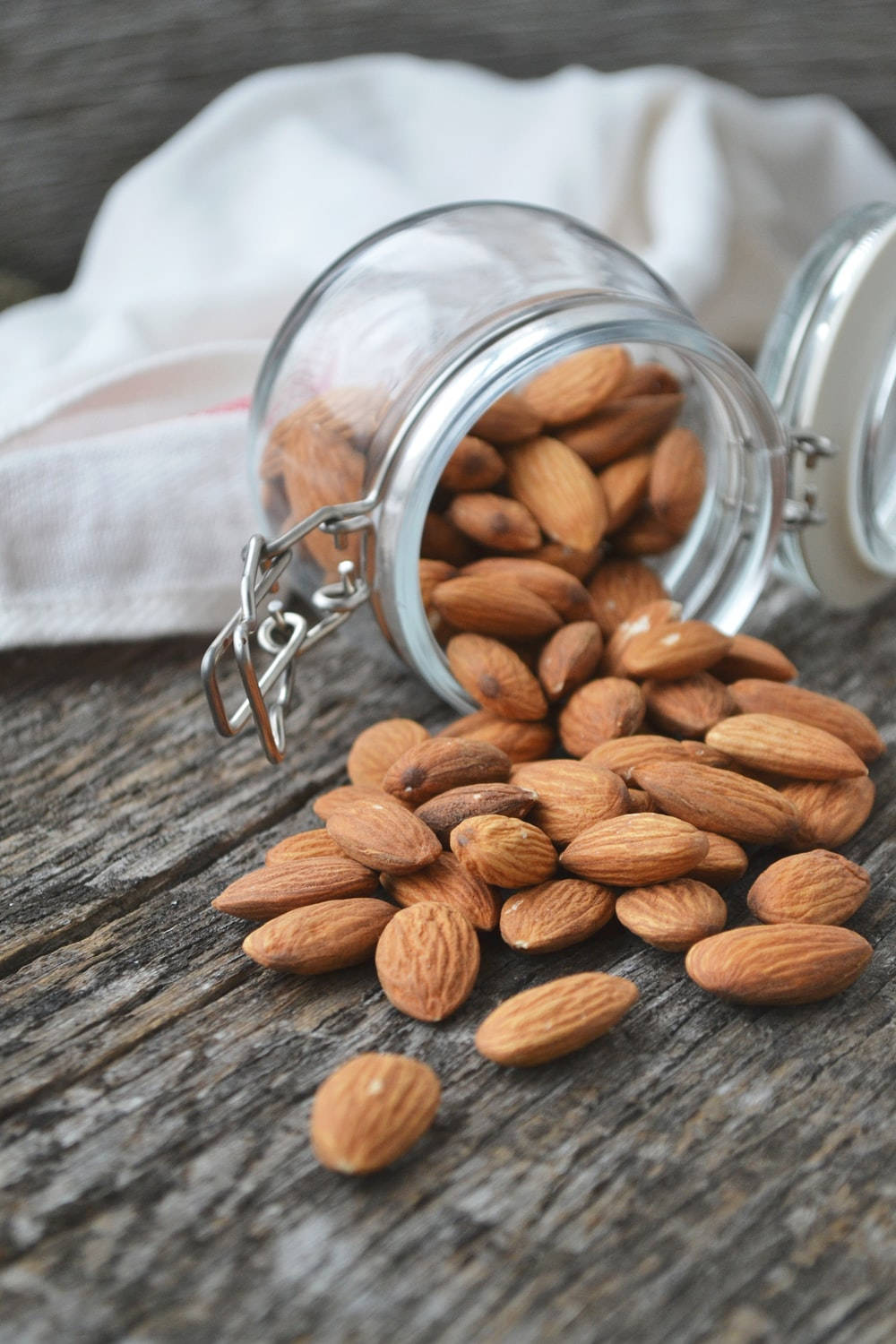 natural raw almonds, glass jar, weathered wooden surface, HD Phone Wallpaper