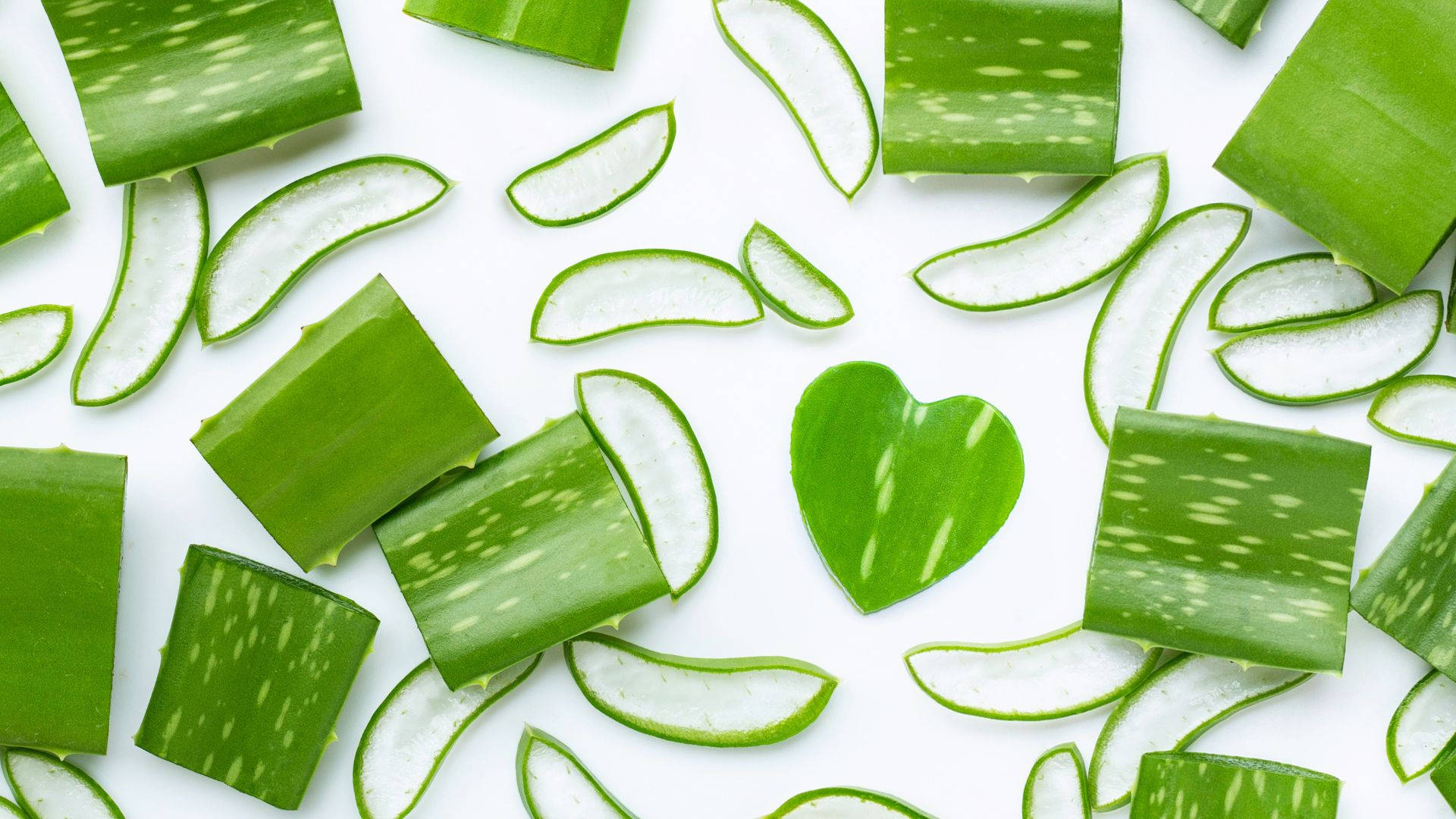 heart-shaped aloe vera slice, fresh green aloe vera leaves, white background, Full HD Desktop Wallpaper
