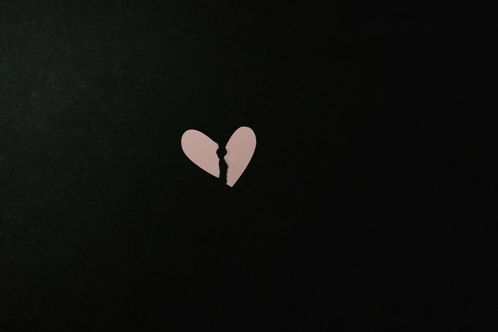 broken heartin darkness, pale pink torn heart cutout, textured black background, Full HD Desktop Wallpaper