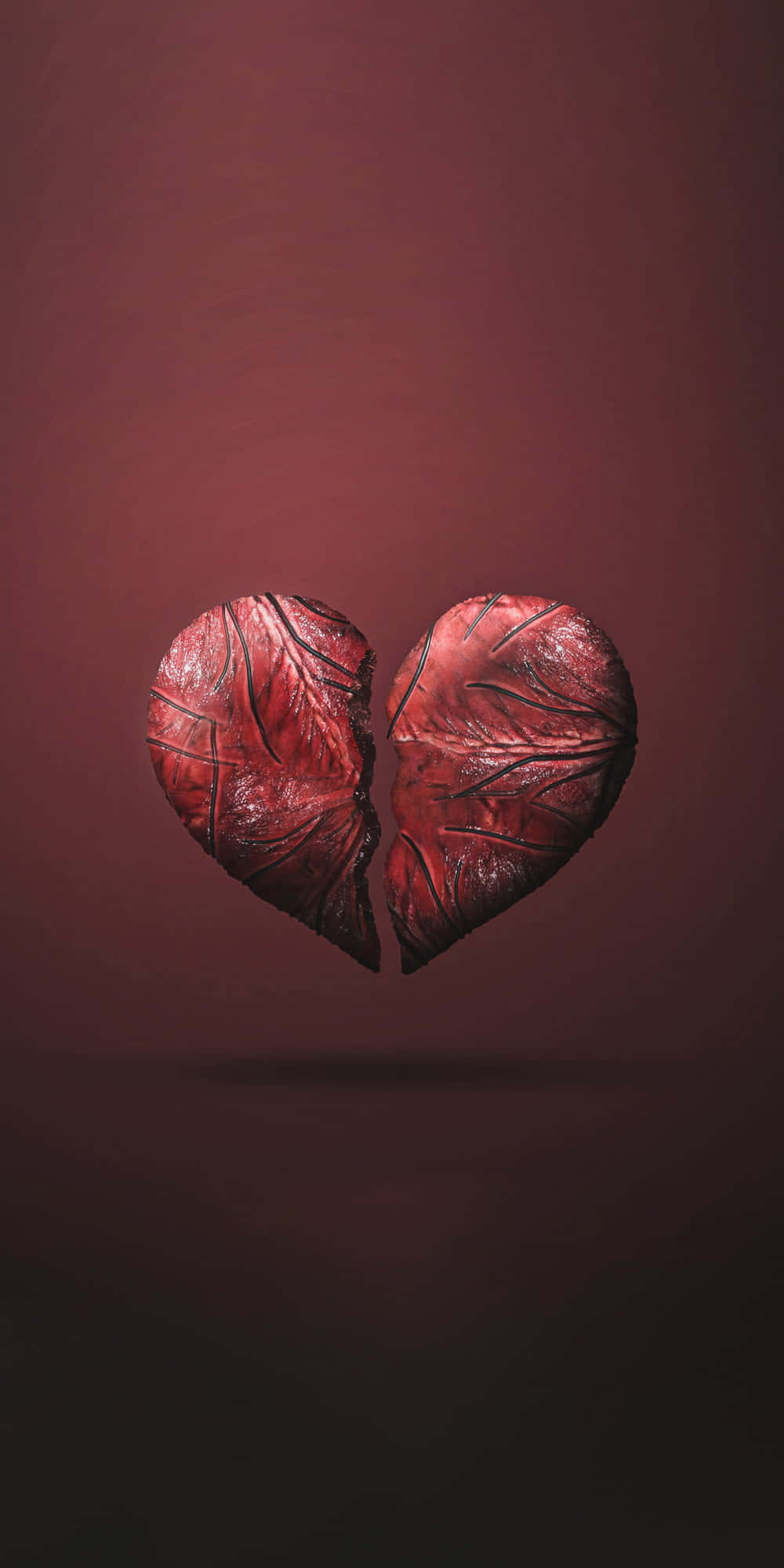 cracked red heart, textured leaves, deep maroon gradient background, Full HD Phone Wallpaper