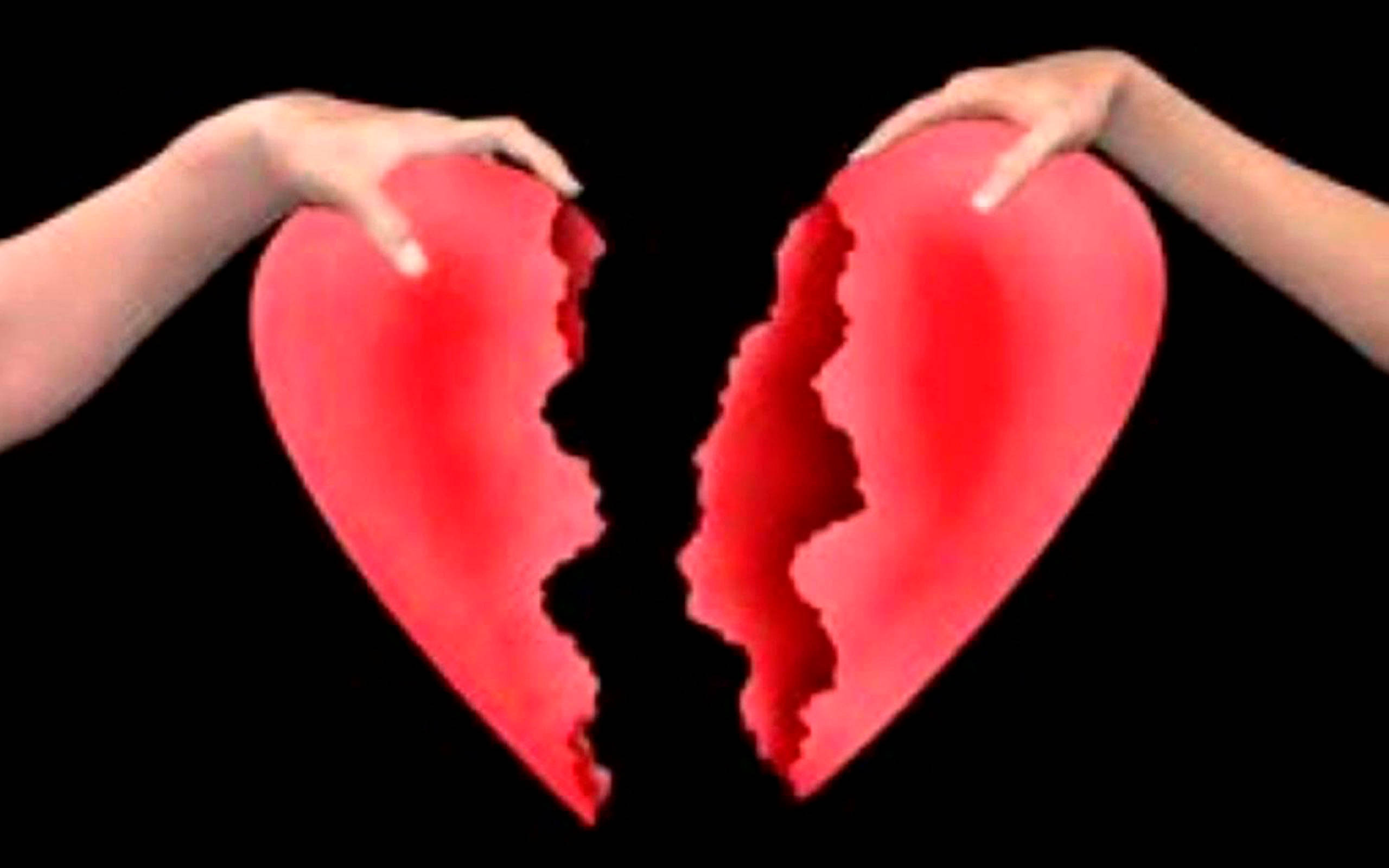 bright red paper heart, black background, two hands, 2K Desktop Wallpaper