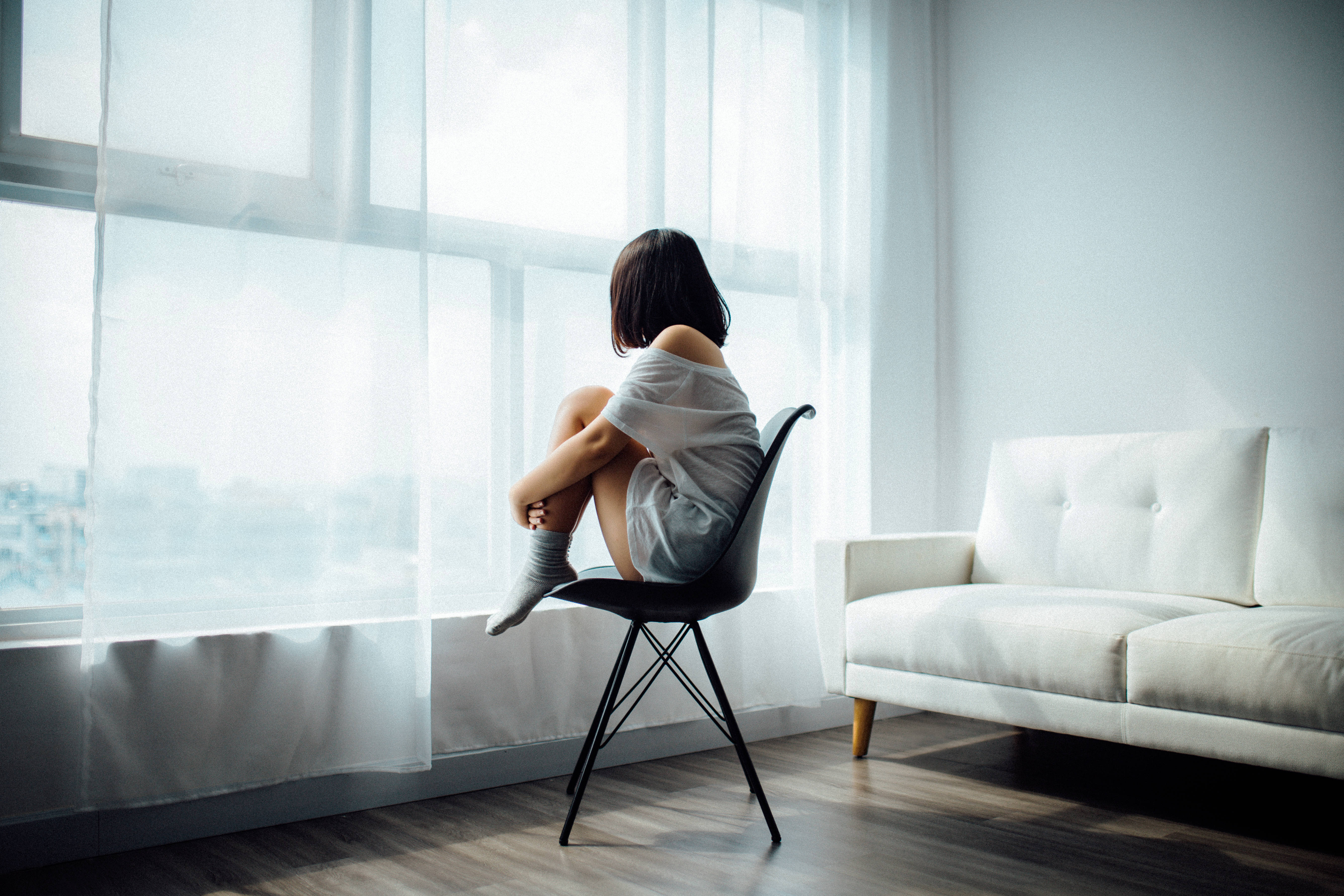 young woman, black chair, bright window, 5K Desktop Wallpaper