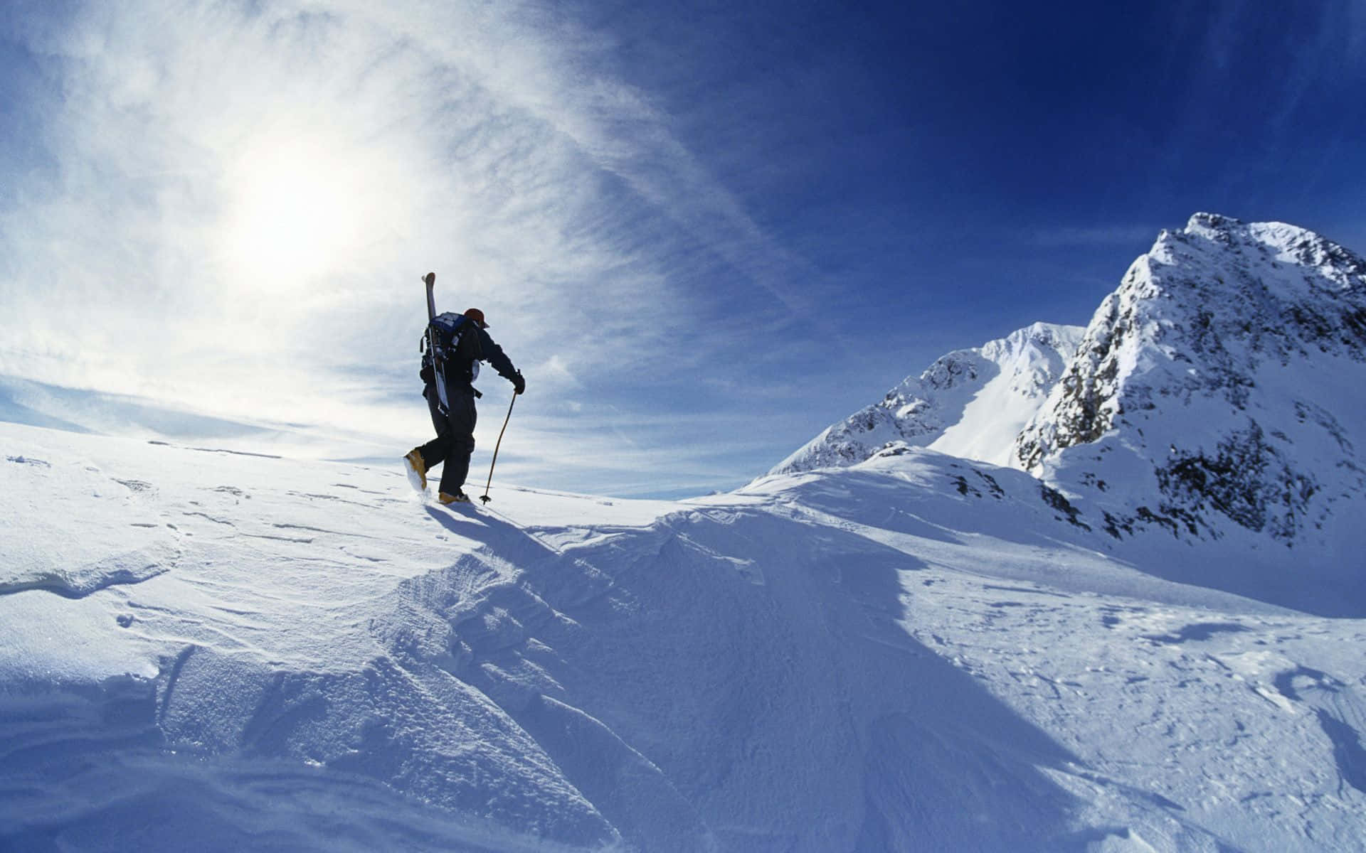snowy mountain ridge, bright sun, dramatic blue skies, Full HD Desktop Wallpaper