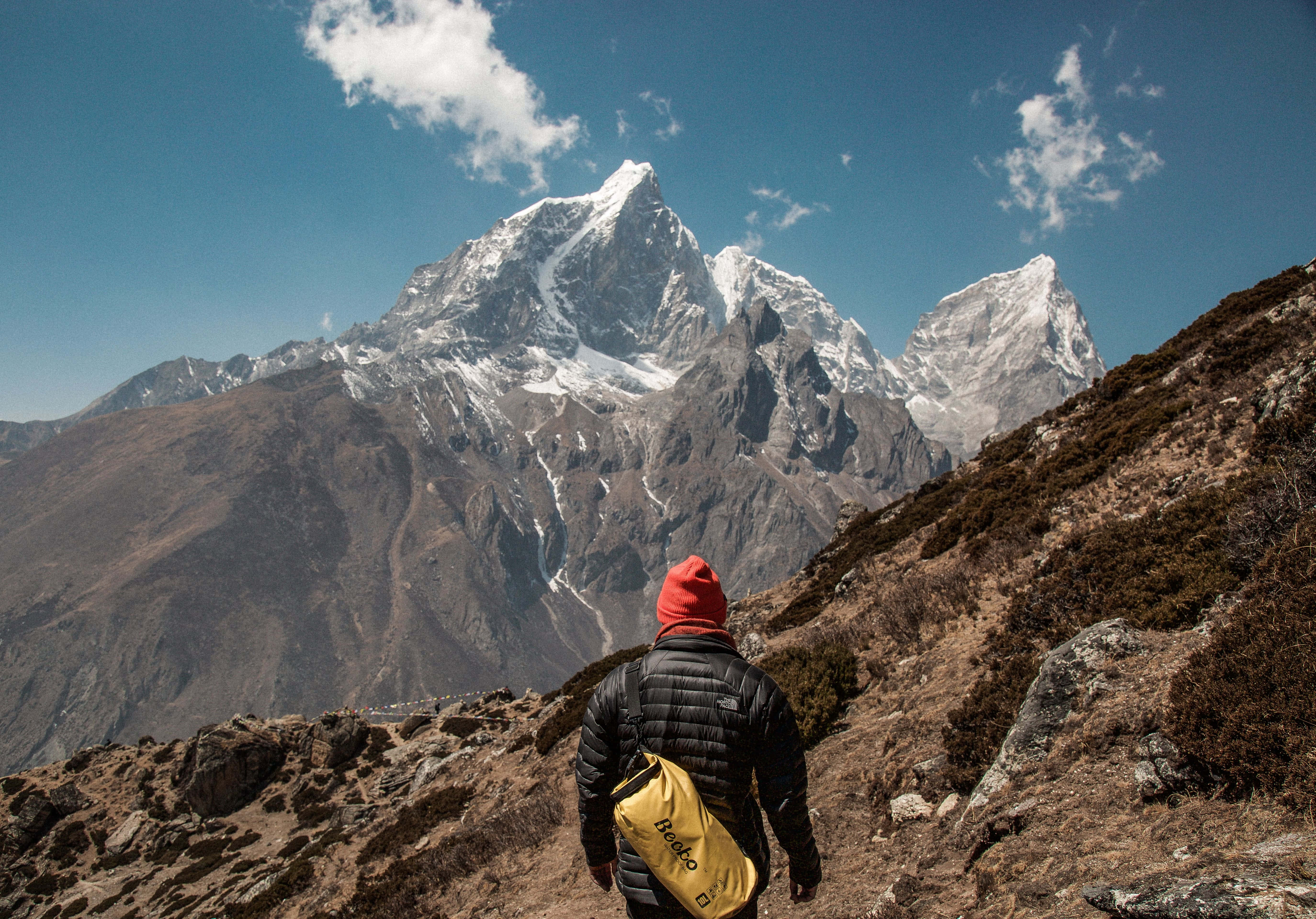 Arduous Walk In Alps, red beanie, yellow backpack, 5K Desktop Wallpaper