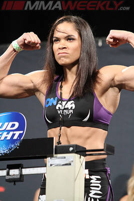 Amanda Nunes, MMA fighter, flexes her arms, SD Phone Wallpaper