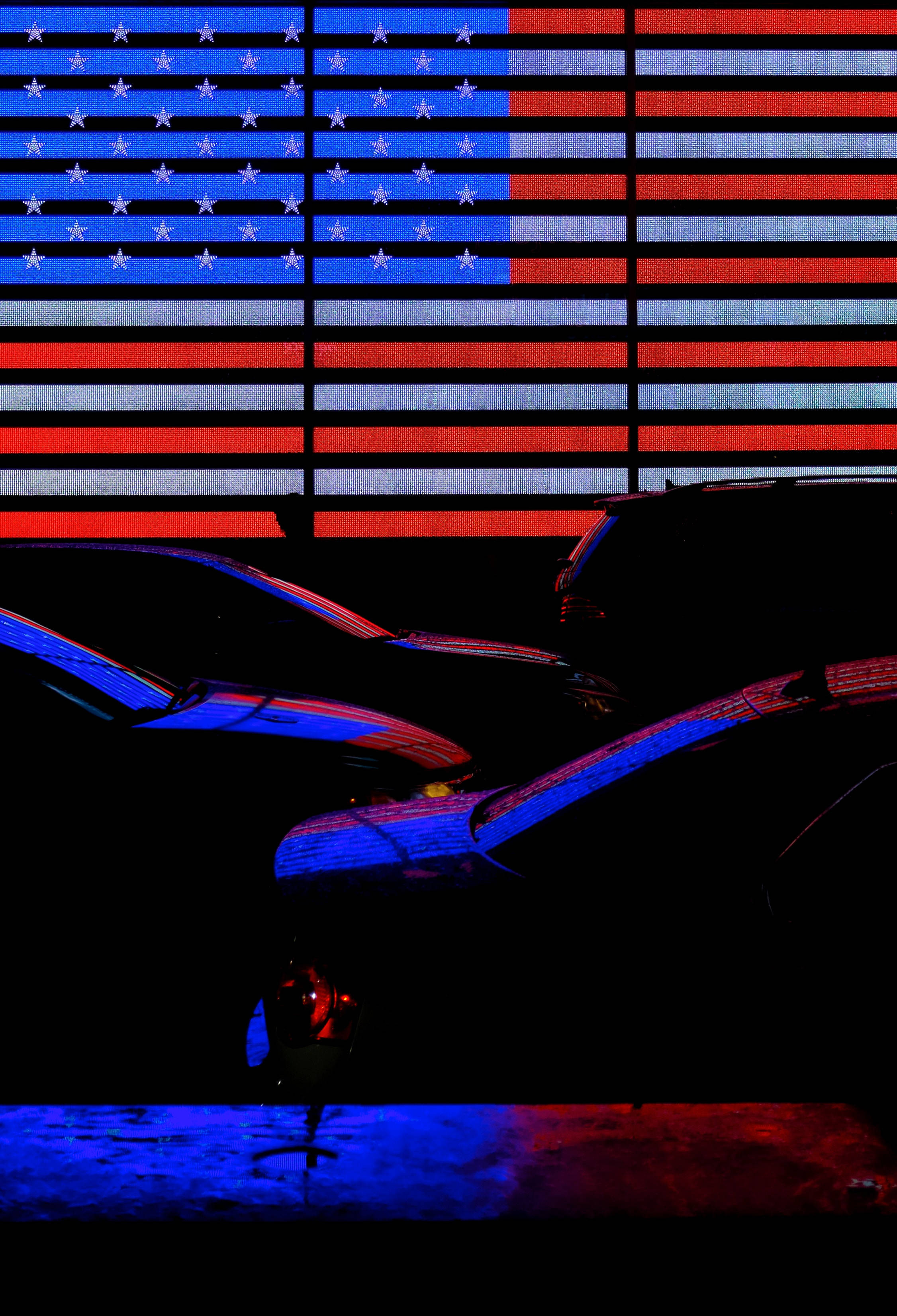 neon American flag, red blue and white stripes, silhouetted cars, 2K Phone Wallpaper