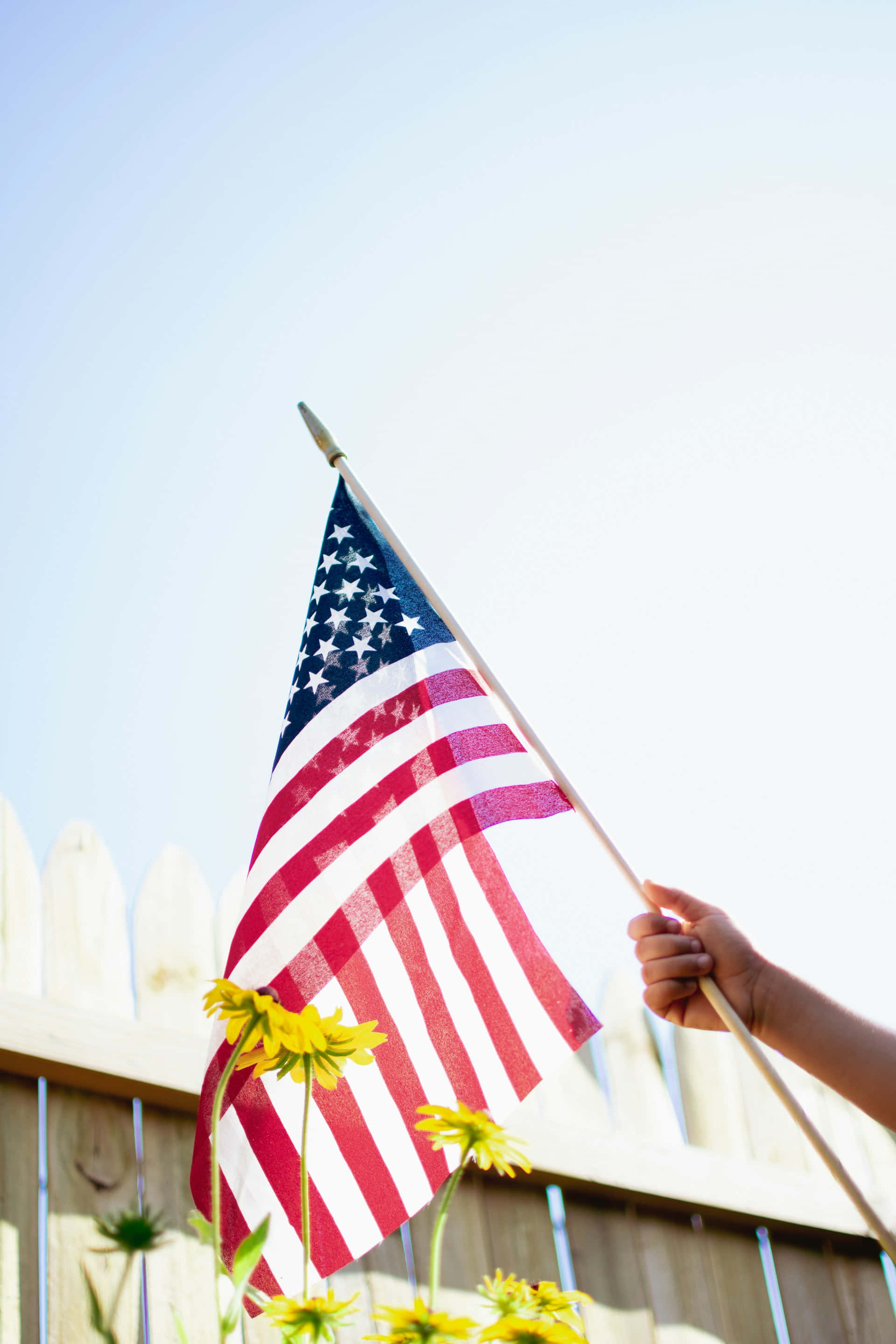 American flag, bright sky, yellow flowers, 2K Phone Wallpaper