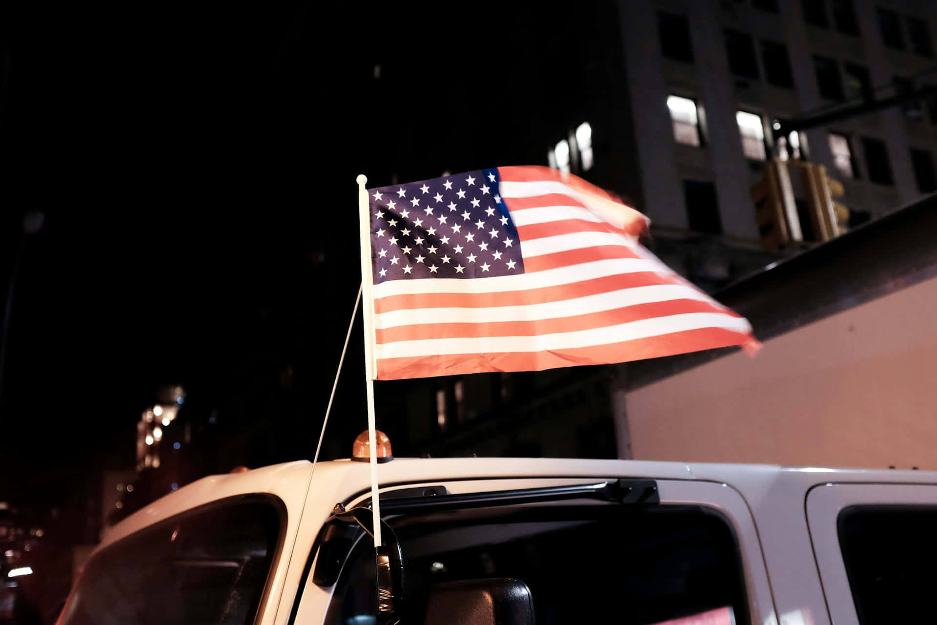 American Flag, nighttime cityscape, white vehicle, Full HD Desktop Wallpaper