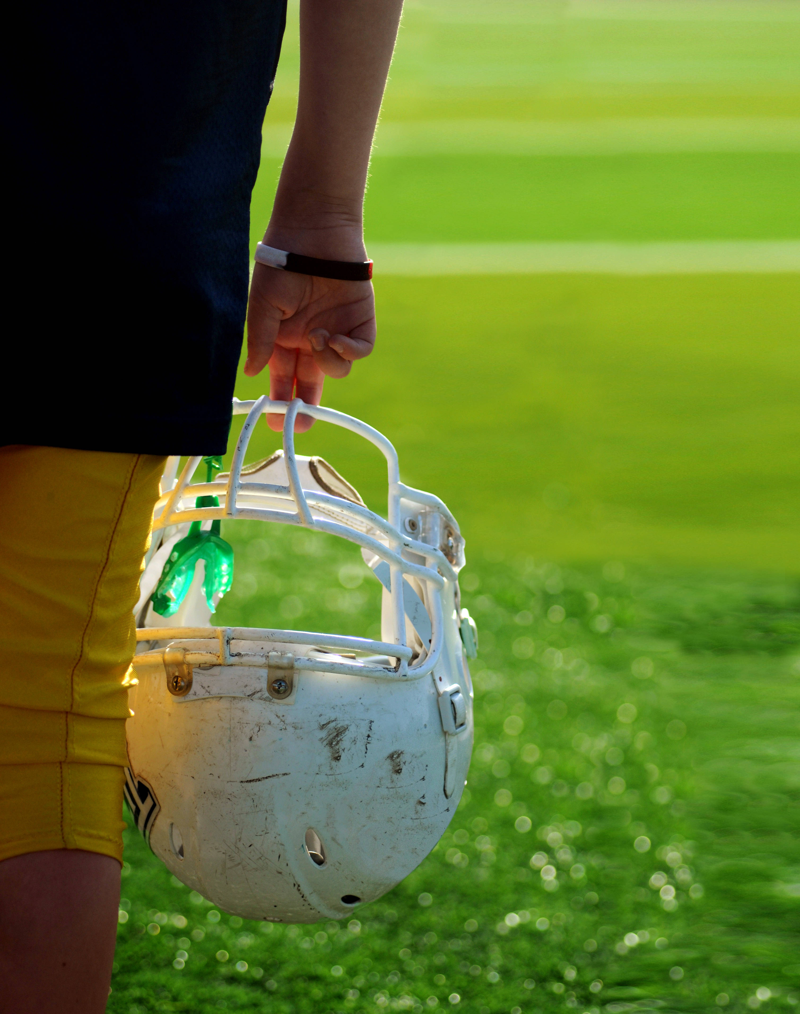 American Football, old helmet, yellow shorts, 4K Phone Wallpaper