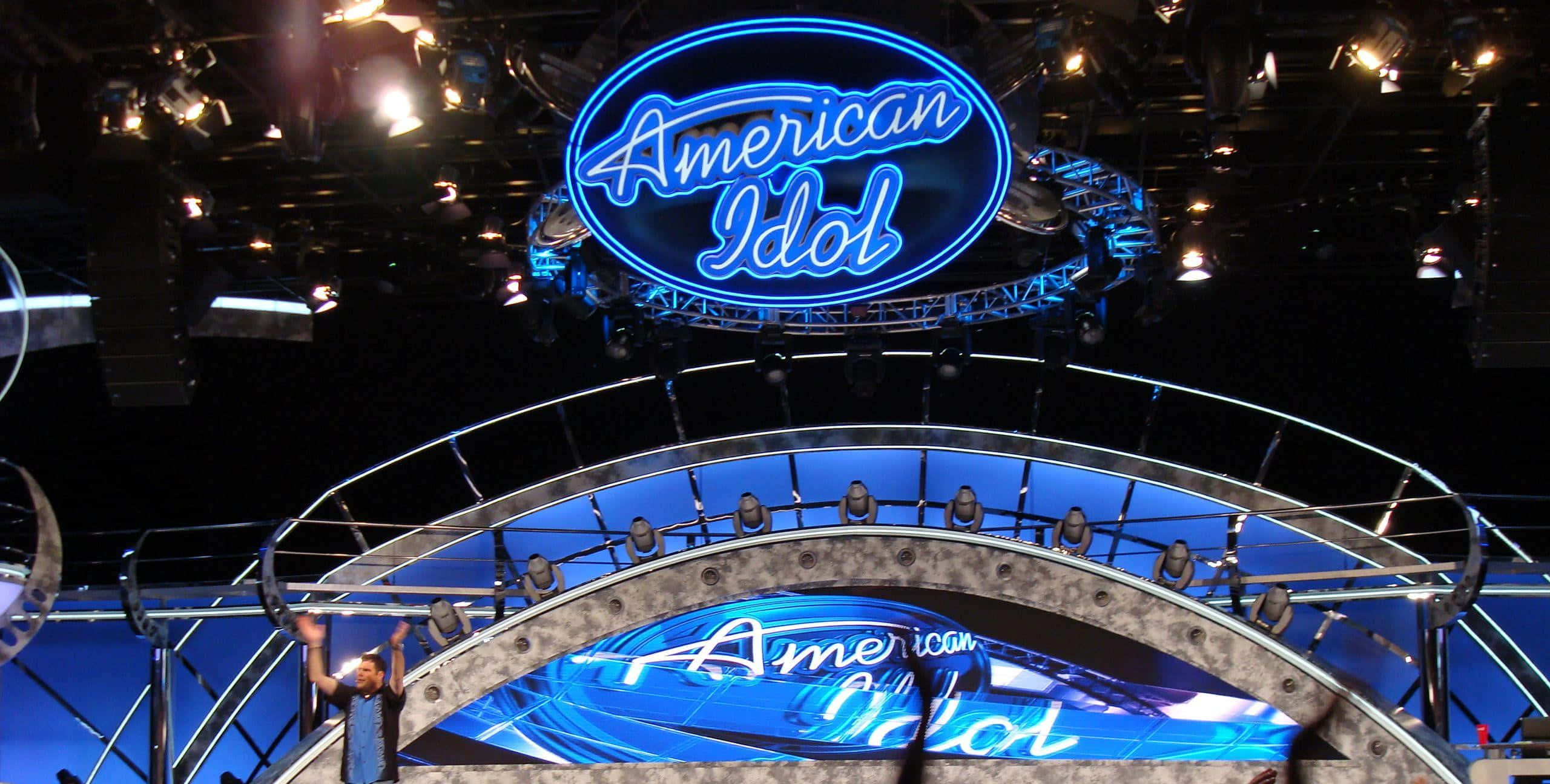 American Idol, glowing blue stage, bright spotlights, 2K Desktop Wallpaper