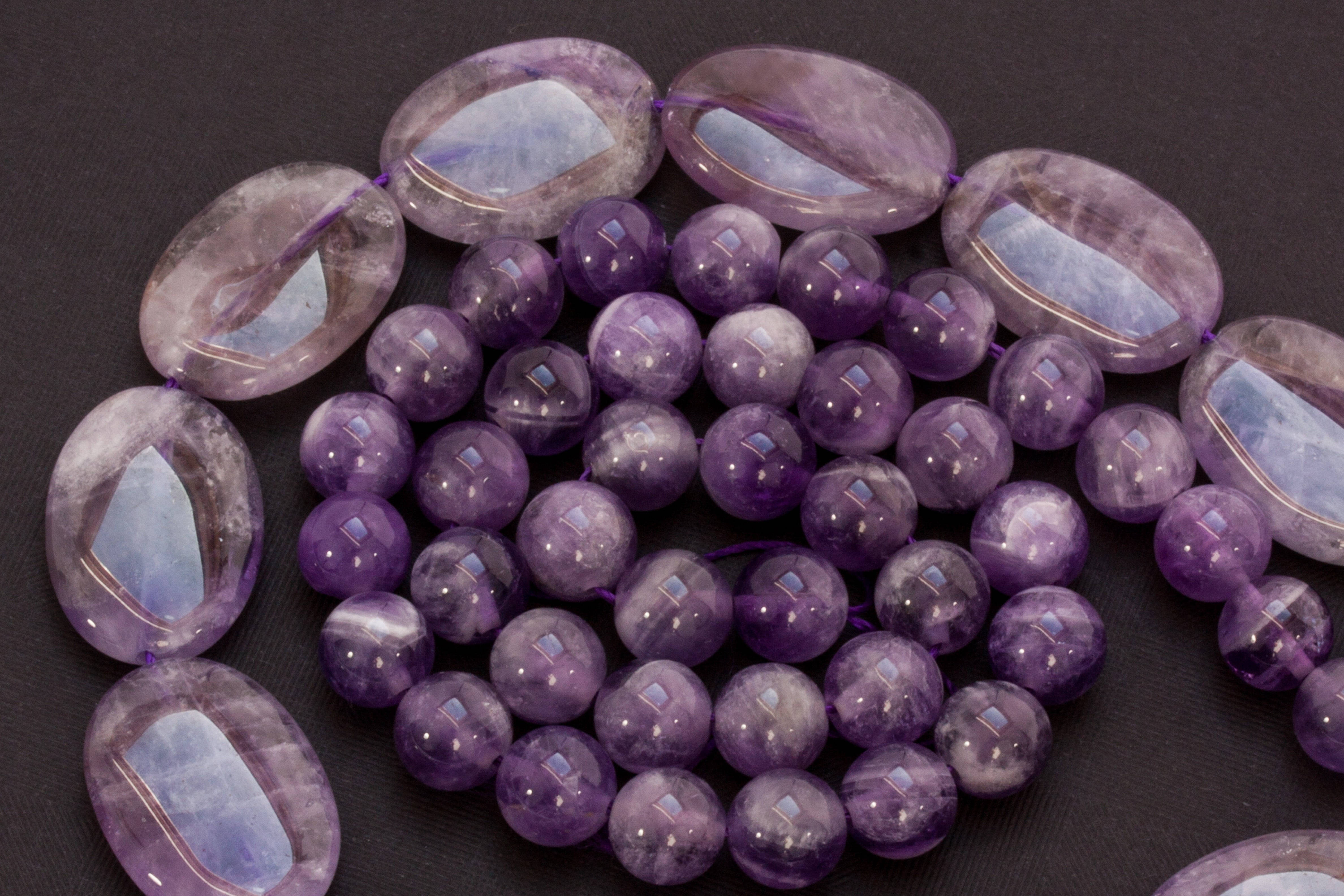 polished amethyst beads, glossy purple amethyst, dark textured surface, 4K Desktop Wallpaper