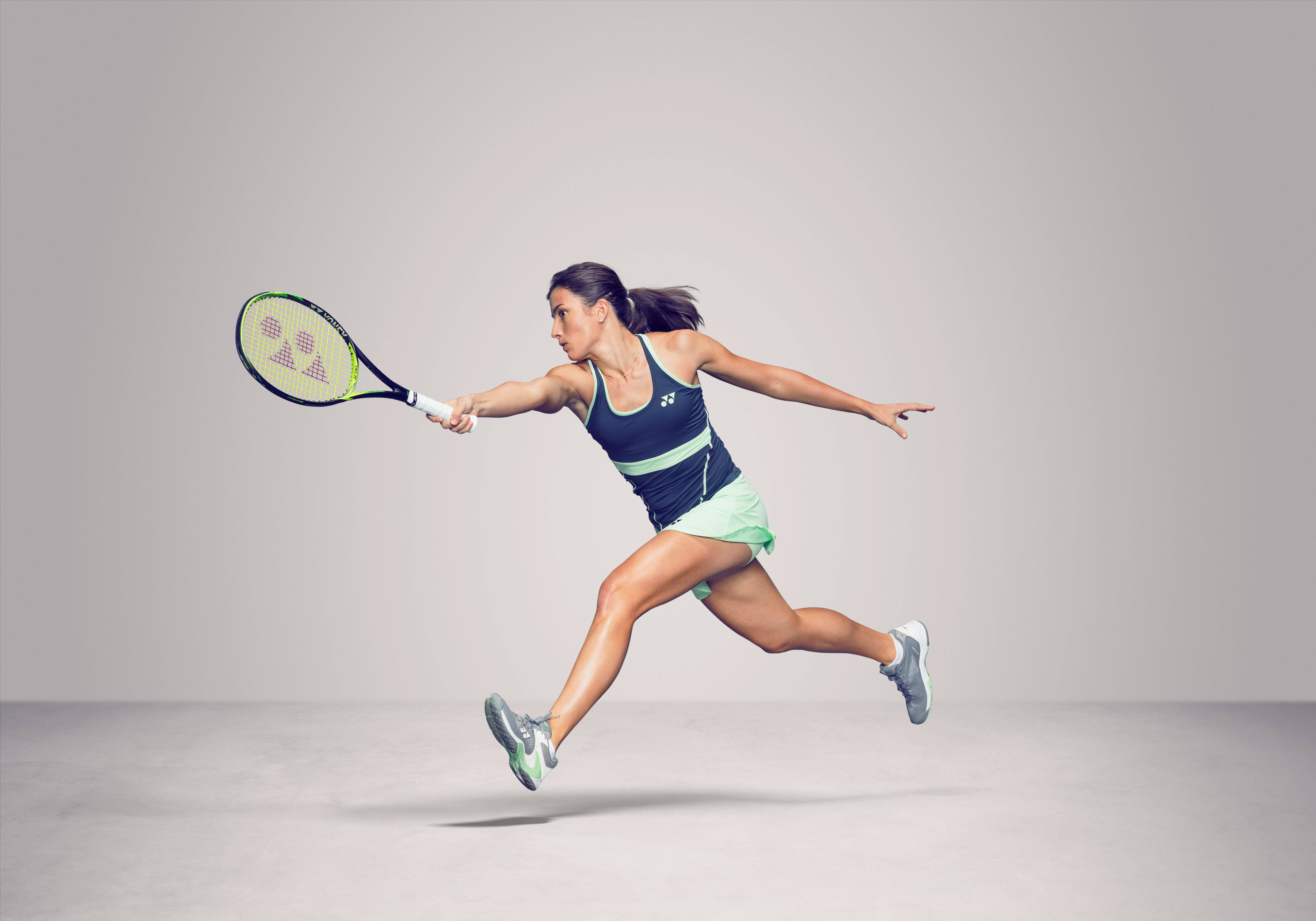 Anastasija Sevastova, tennis player, leaps dynamically mid-swing, 5K Desktop Wallpaper