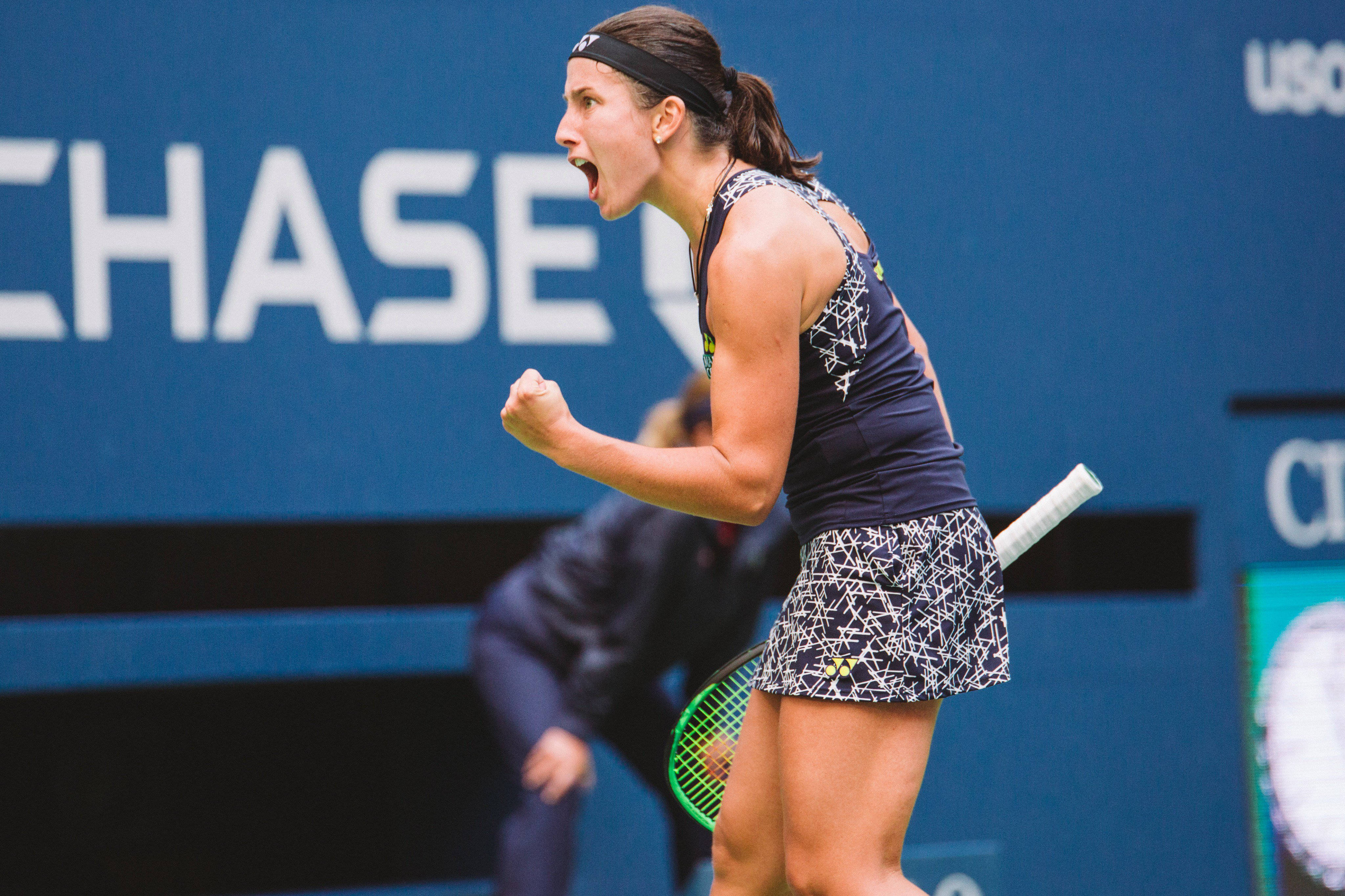 Anastasija Sevastova, blue court, raised fist, 4K Desktop Wallpaper
