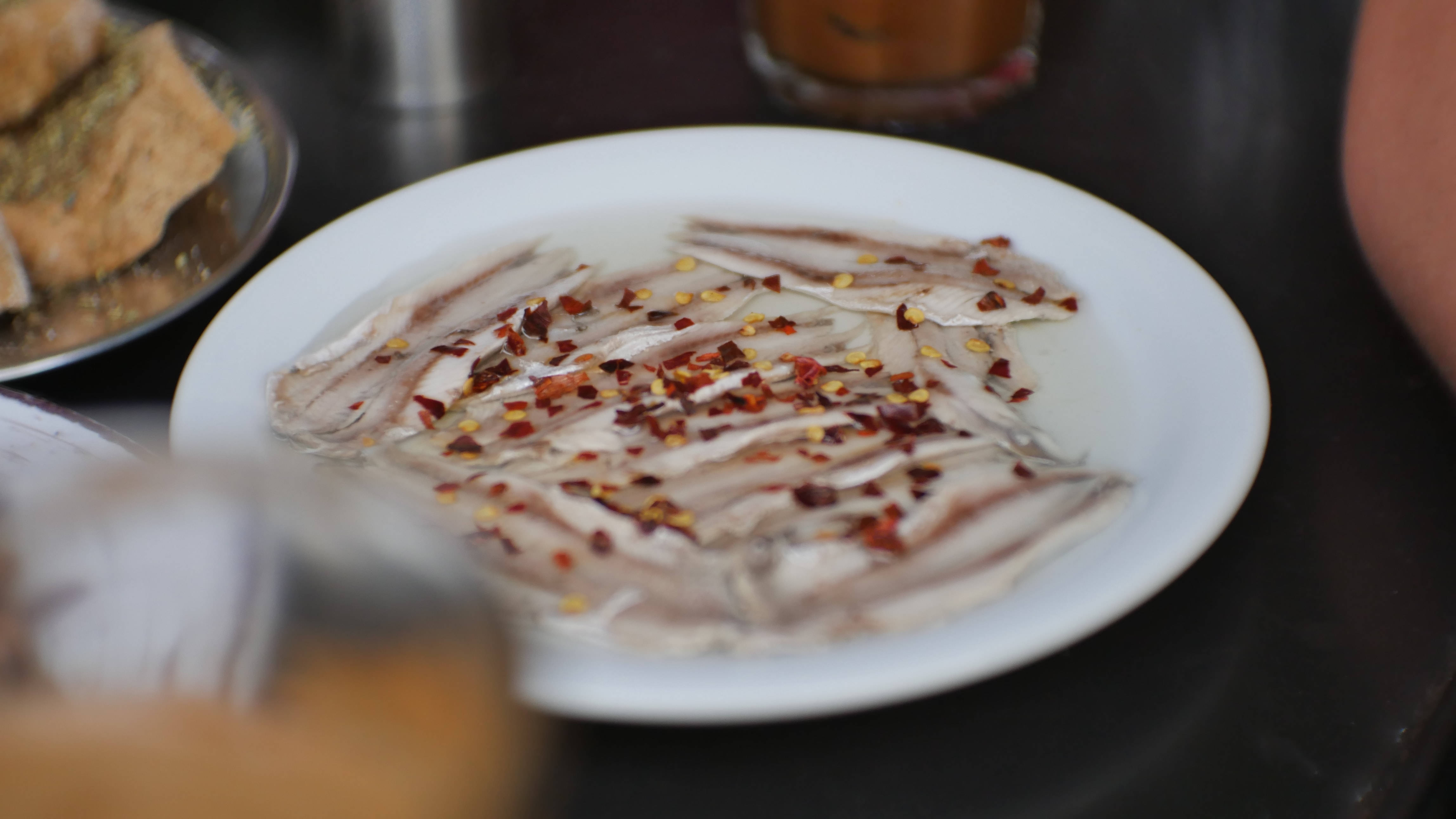 anchovies, white plate, red chili flakes, 4K Desktop Wallpaper