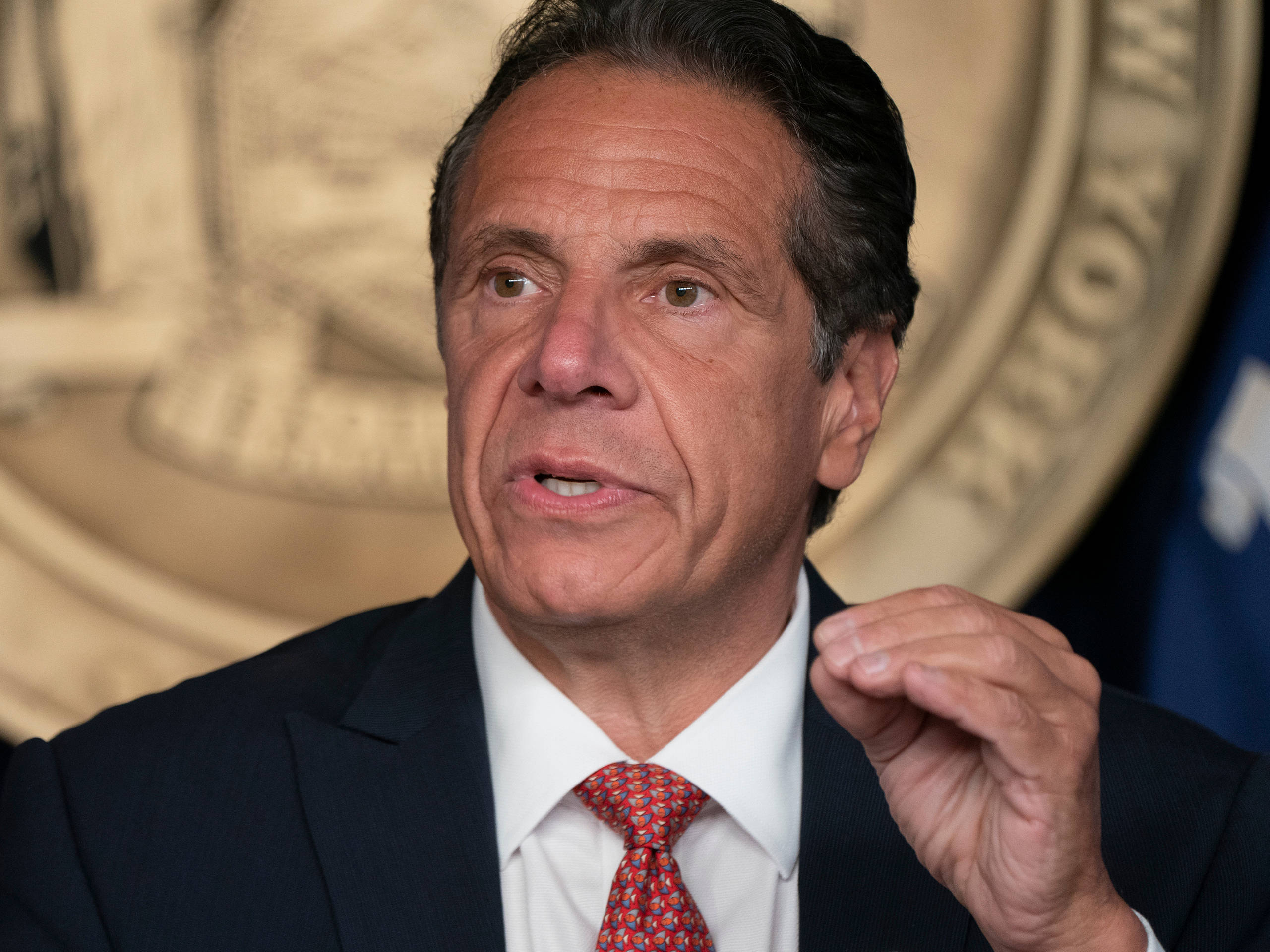 Andrew Cuomo, dark suit, red patterned tie, 2K Desktop Wallpaper