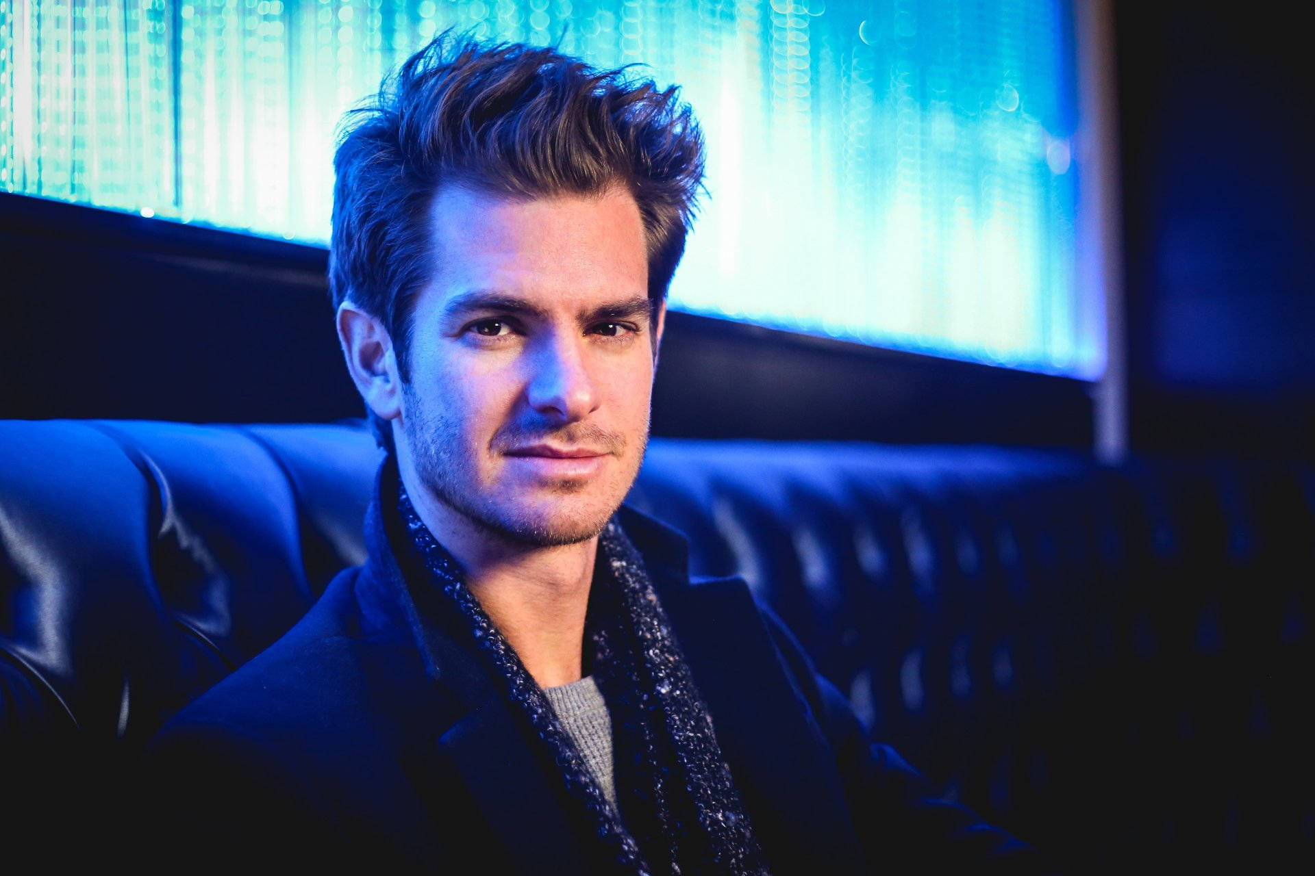 Andrew Garfield, blue leather couch, cool blue ambient lighting, Full HD Desktop Wallpaper