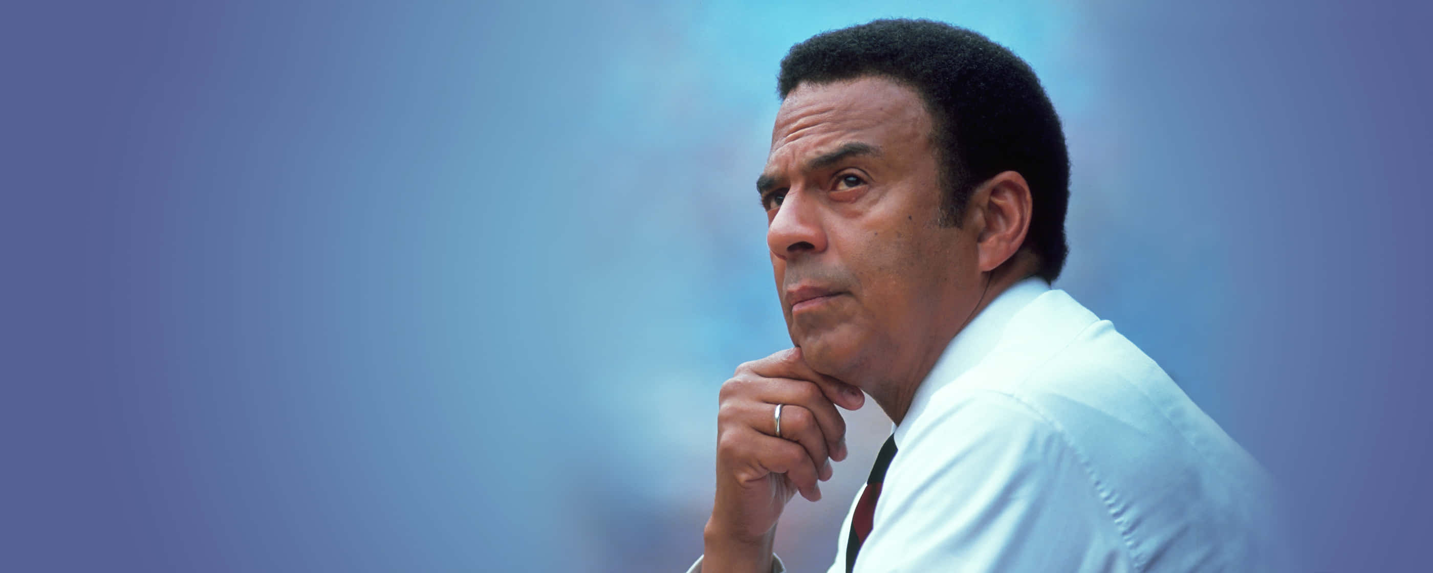 Andrew Young, white shirt, soft blue gradient background, 2K Desktop Wallpaper