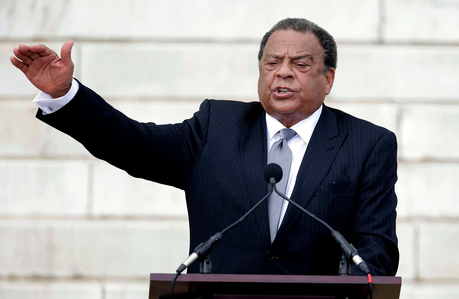 Andrew Young, dark pinstripe suit, outdoor podium, HD Desktop Wallpaper