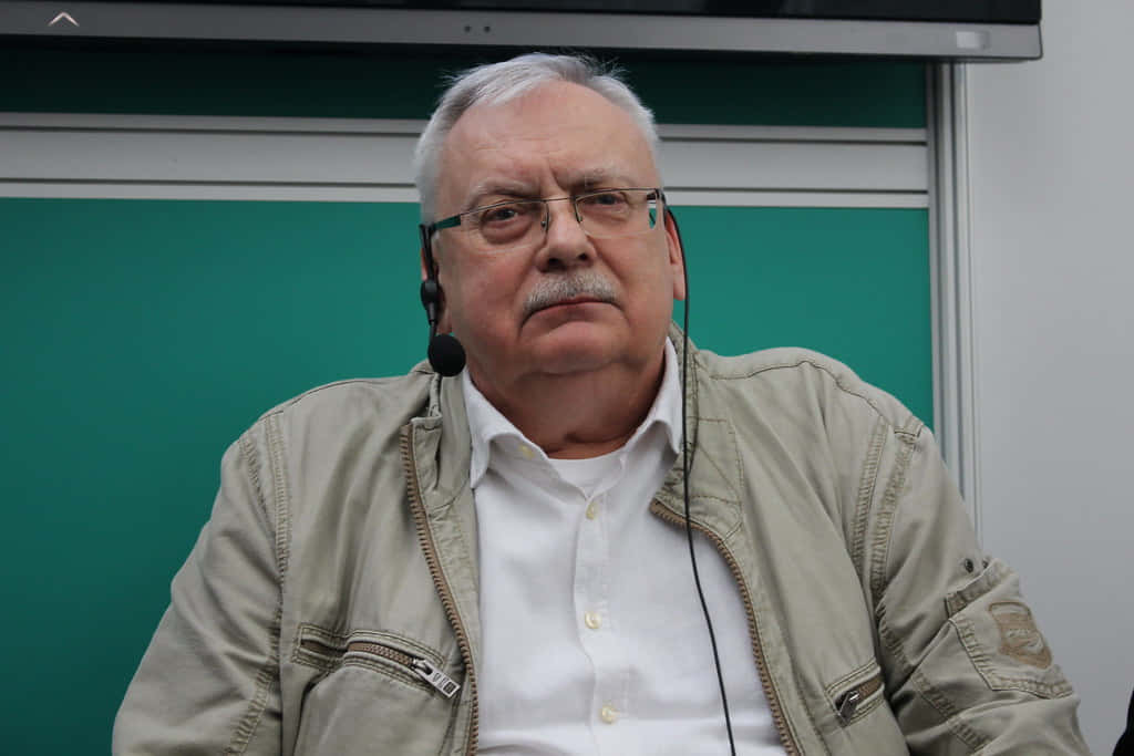 Andrzej Sapkowski, beige jacket, glasses, SD Desktop Wallpaper