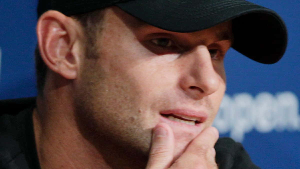 Andy Roddick, black cap, blue background, SD Desktop Wallpaper
