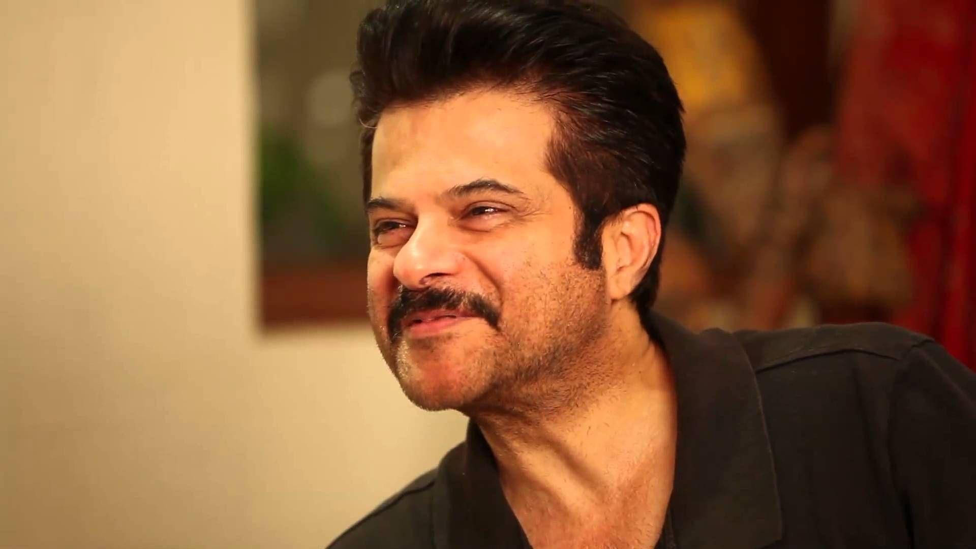 Anil Kapoor, mustache, softly lit indoor setting, Full HD Desktop Wallpaper