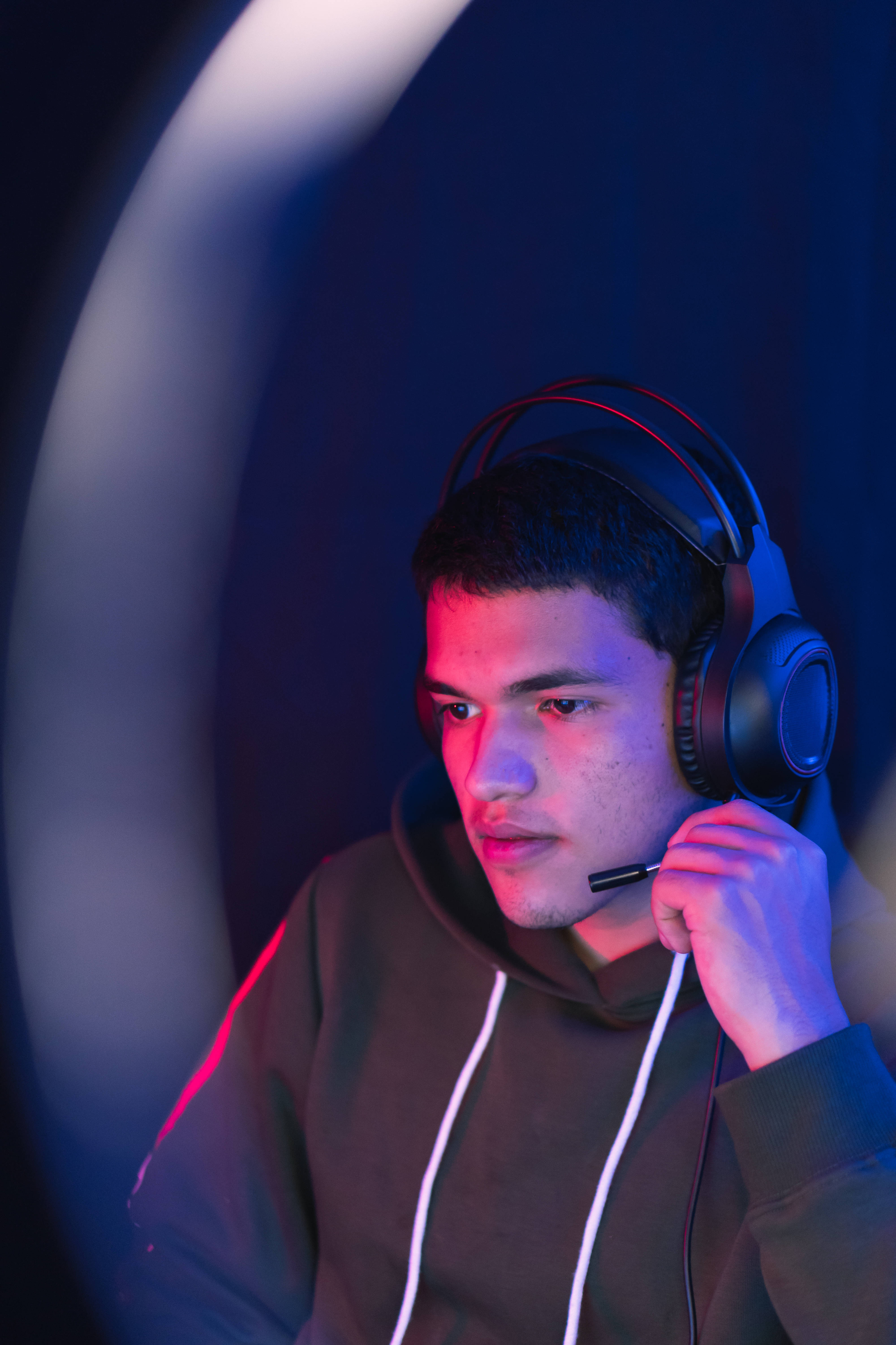 boy gamer, hoodie, neon red and blue lighting, 5K Phone Wallpaper