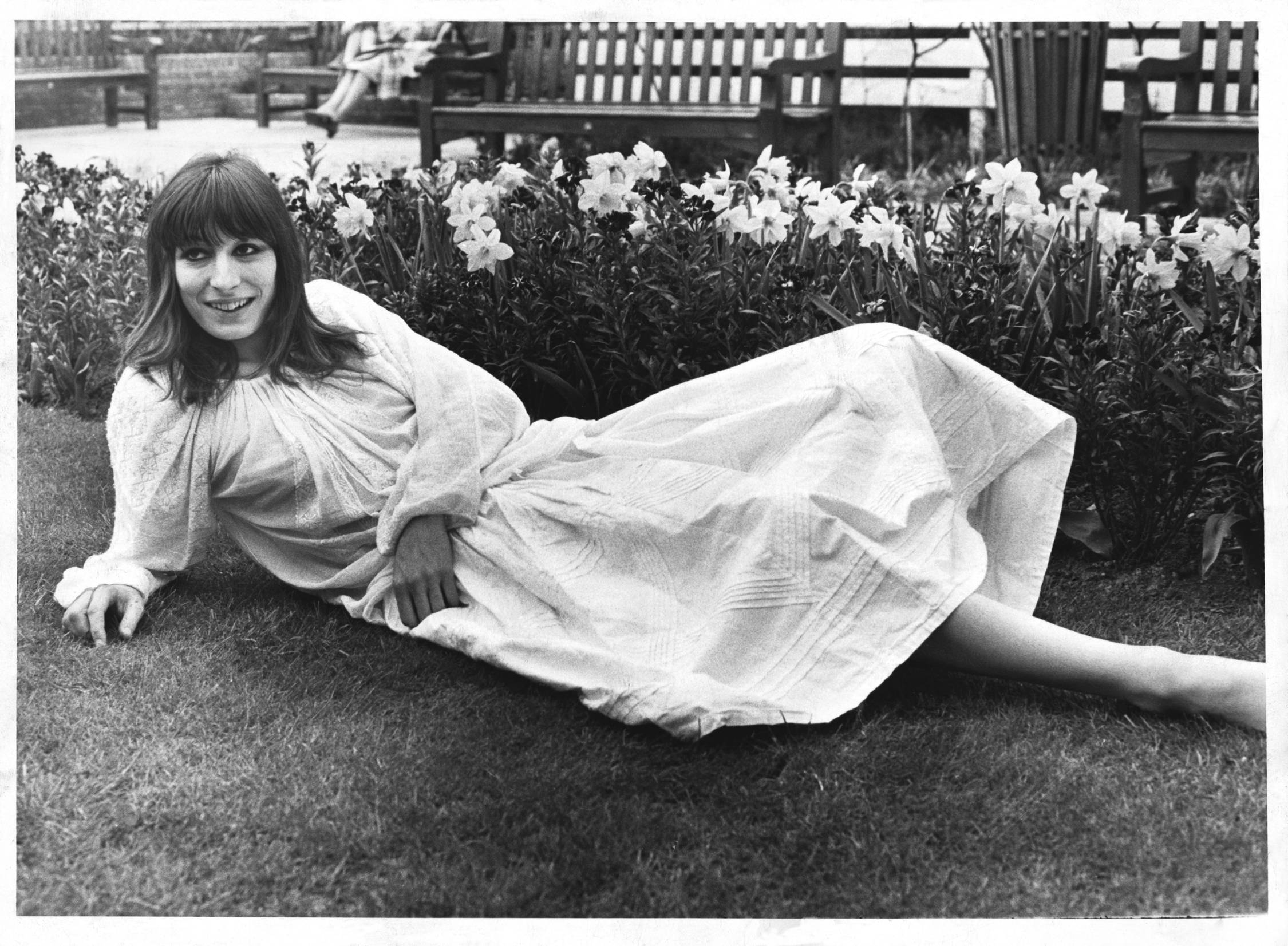 Anjelica Huston, vintage grayscale photograph, flowing white dress, Full HD Desktop Wallpaper