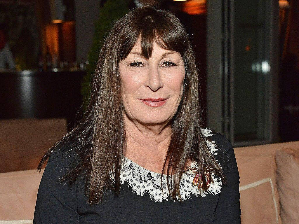 Anjelica Huston, long brown hair, lace-trimmed black top, SD Desktop Wallpaper