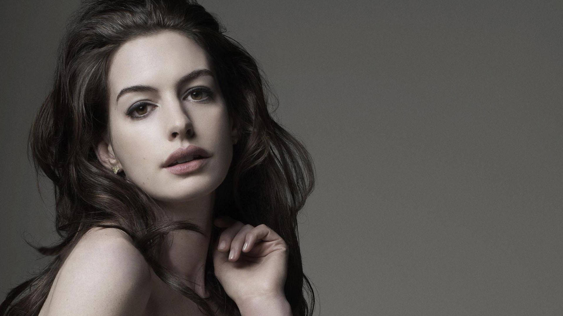 Anne Hathaway, muted gray background, long dark hair, Full HD Desktop Wallpaper