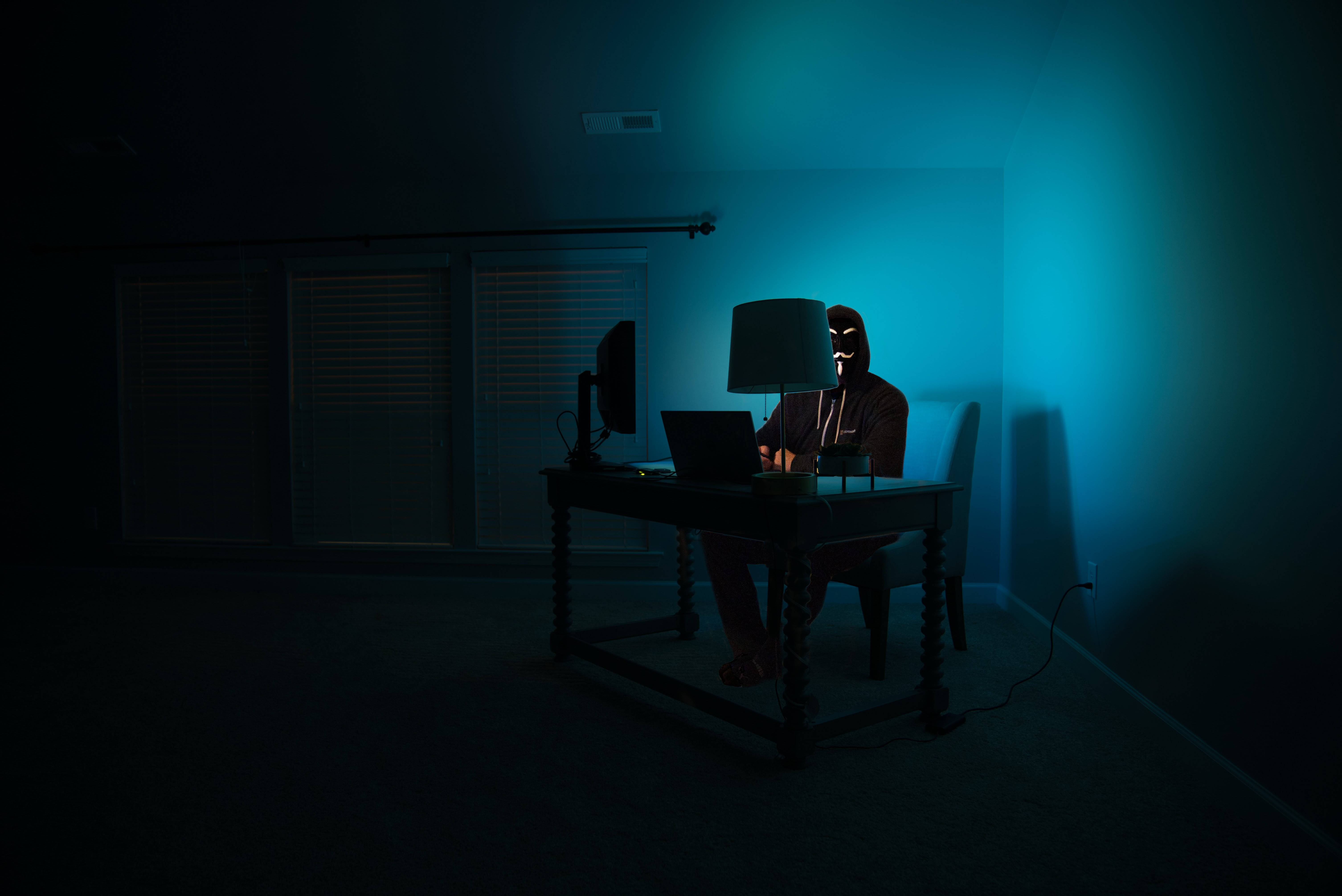 Anonymous, dark room, eerie blue light, 5K Desktop Wallpaper