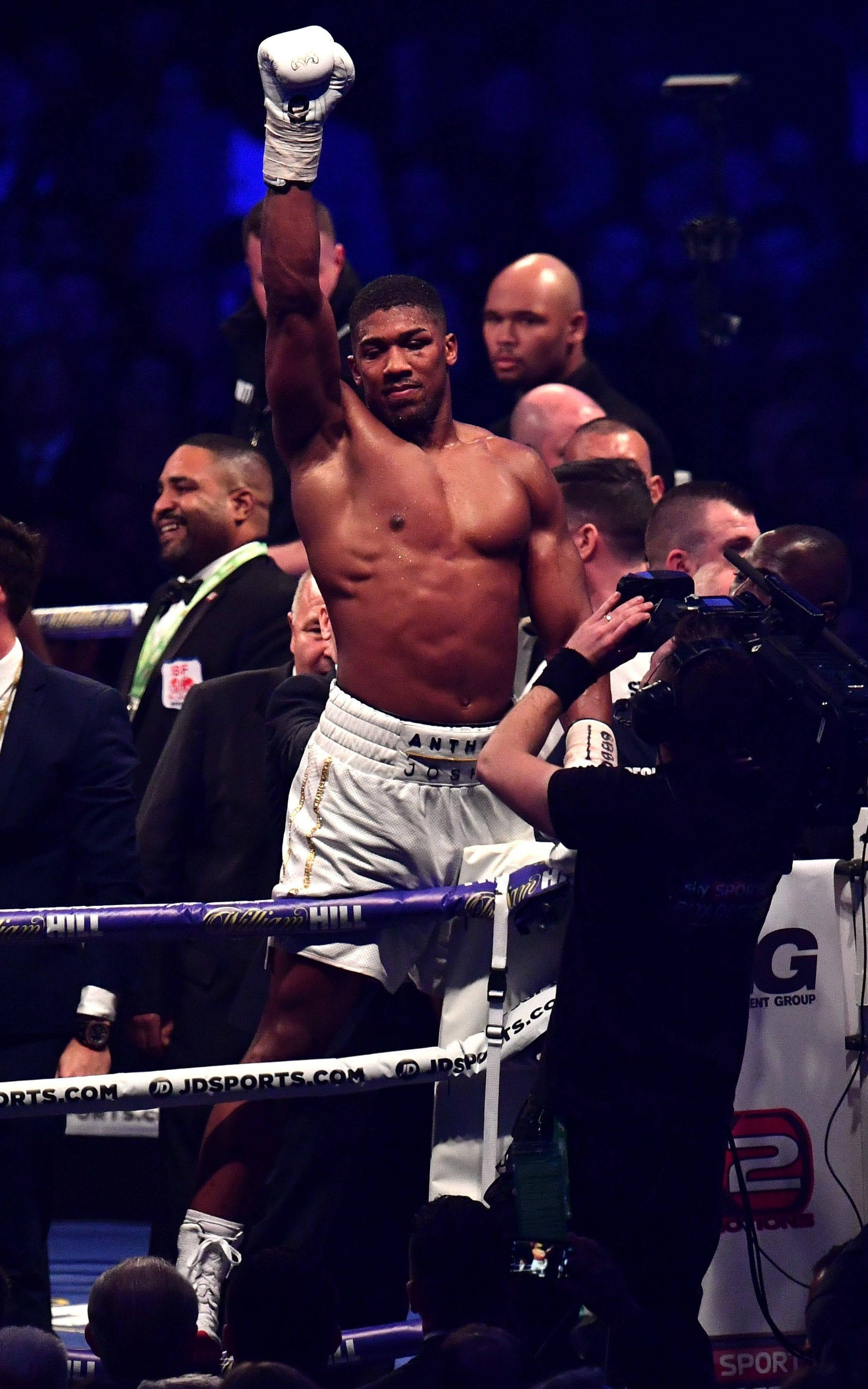 Anthony Joshua, raised right hand, brightly lit ring, 2K Phone Wallpaper