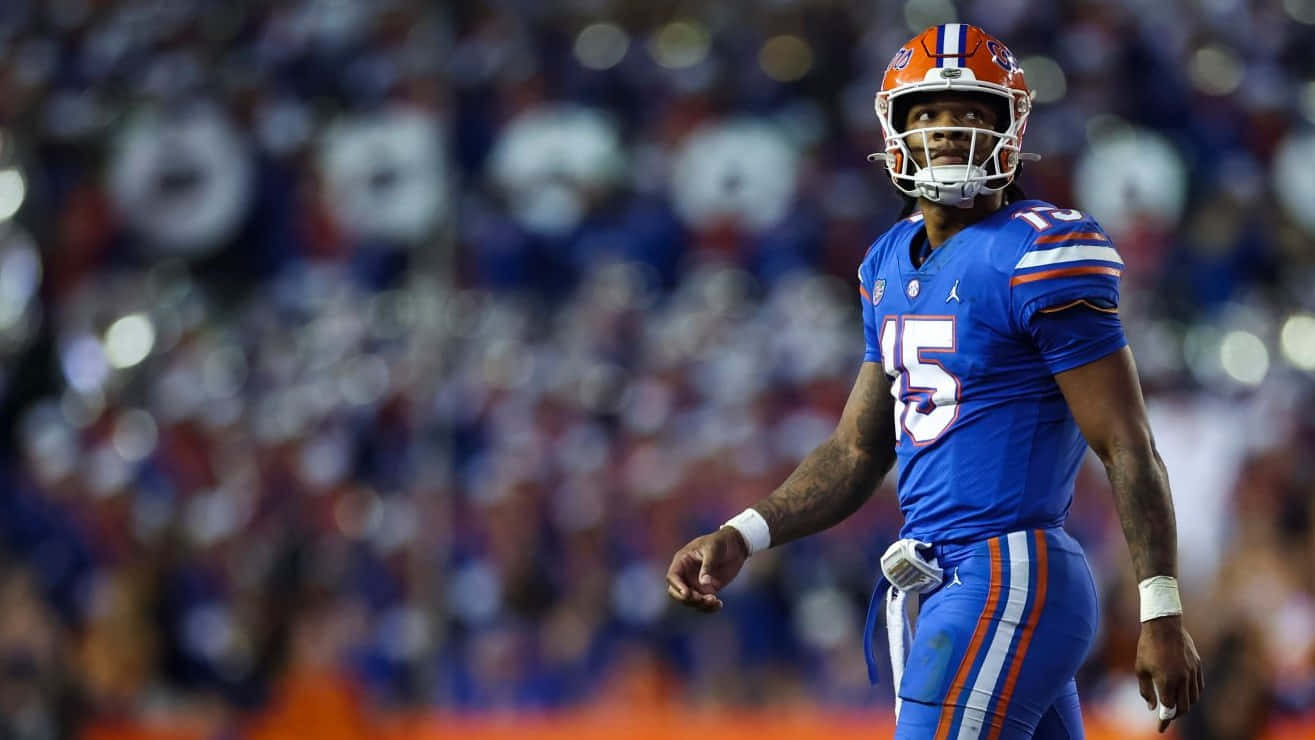 Anthony Richardson, blue and orange uniform, stadium lights, HD Desktop Wallpaper