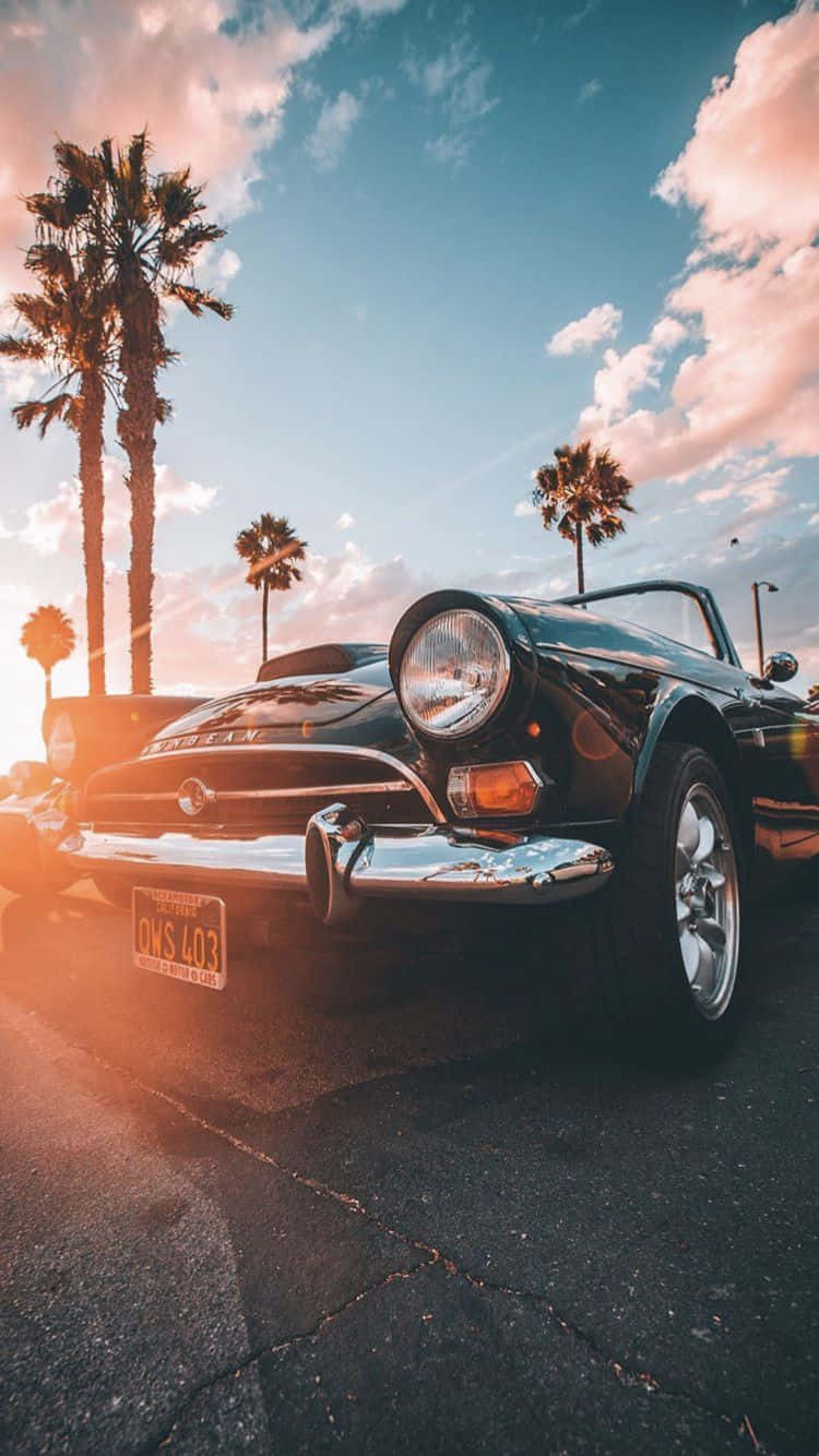 vintage black convertible sports car, warm sunset sky, palm trees, HD Phone Wallpaper