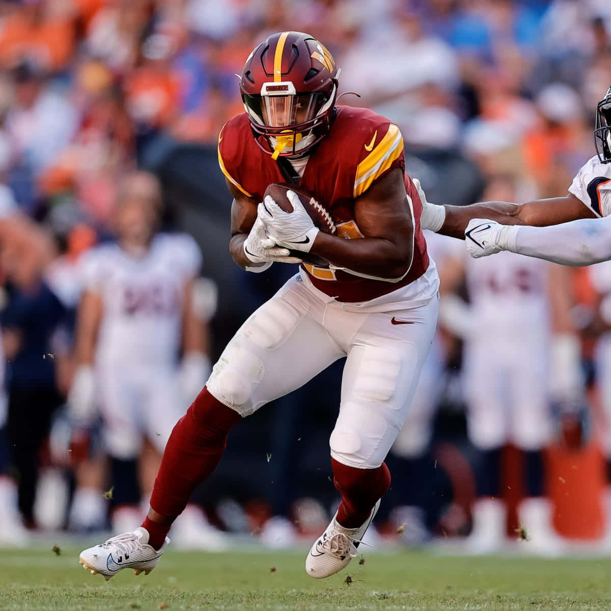 Antonio Gibson, maroon and gold uniform, sunlit field, SD Desktop Wallpaper