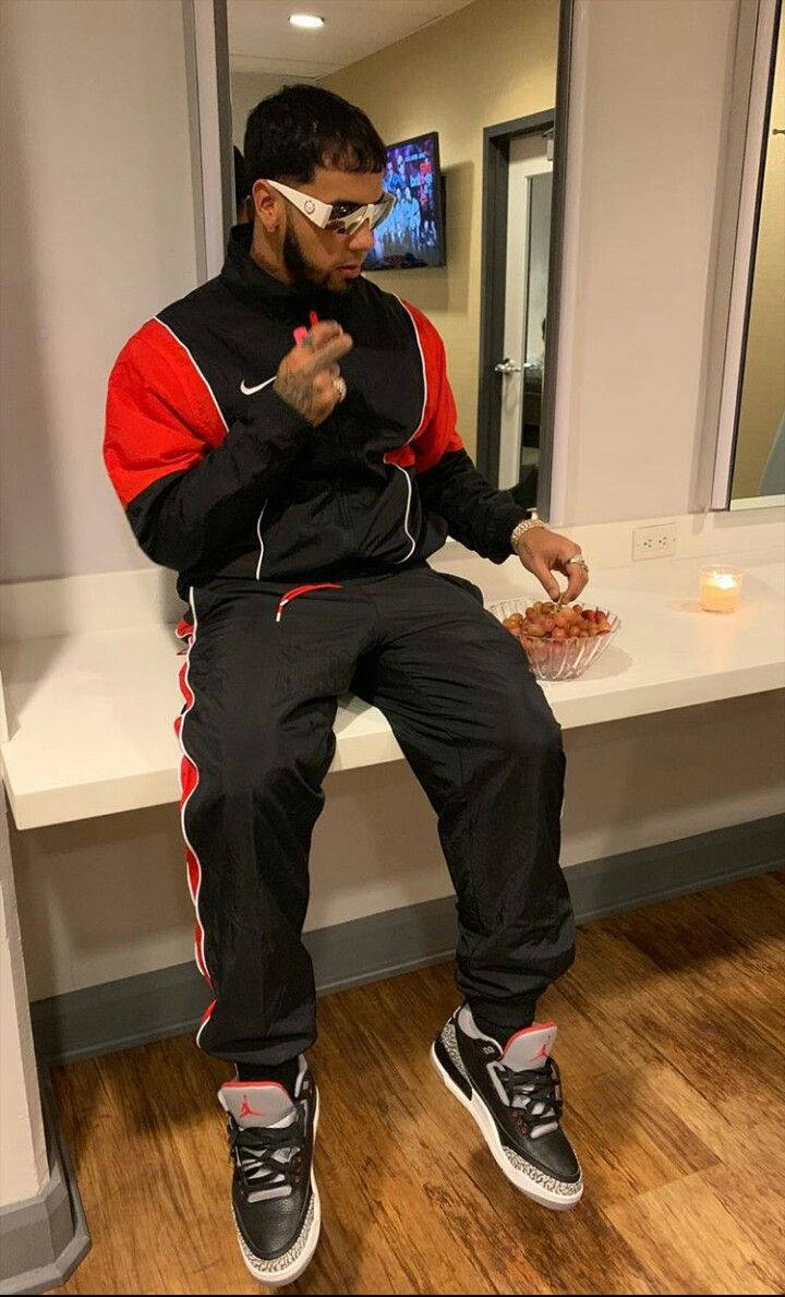 Anuel AA, black and red tracksuit, white counter, SD Phone Wallpaper