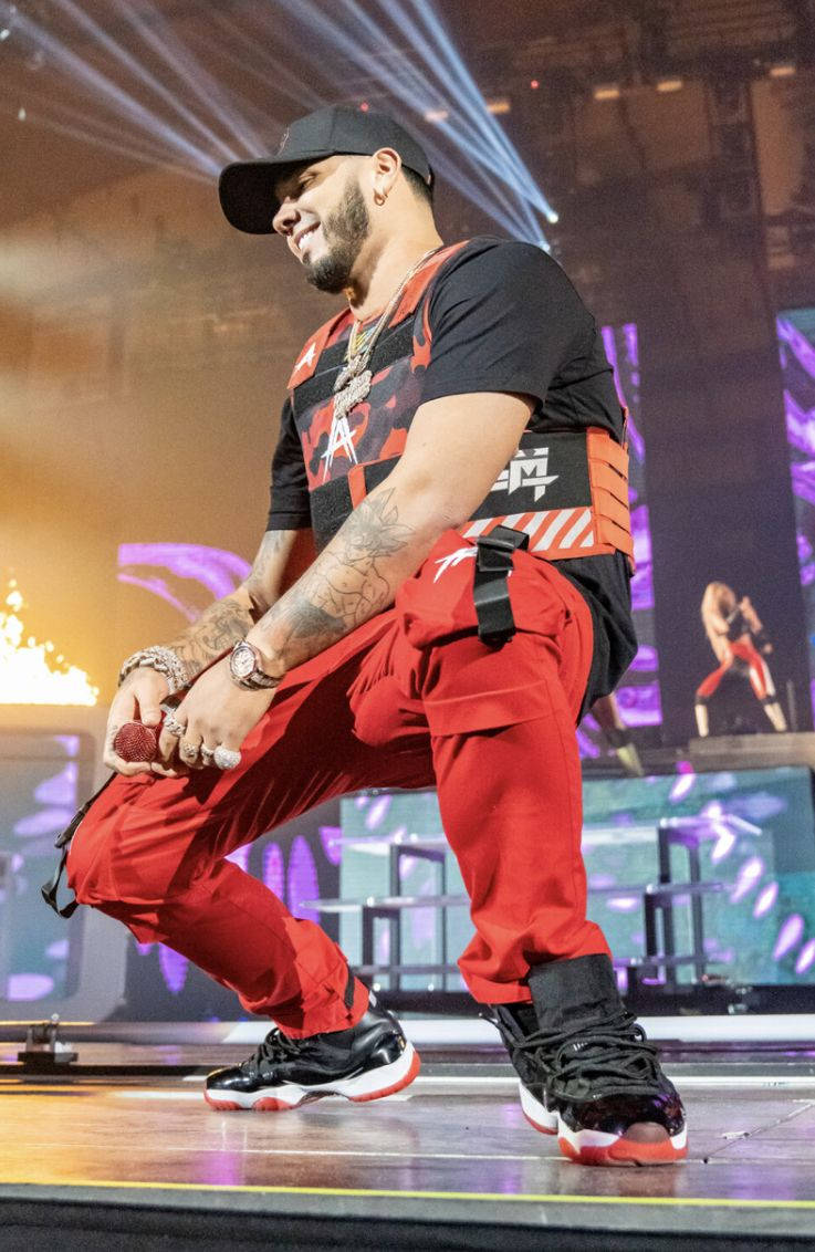 Anuel AA, red pants, black cap, SD Phone Wallpaper