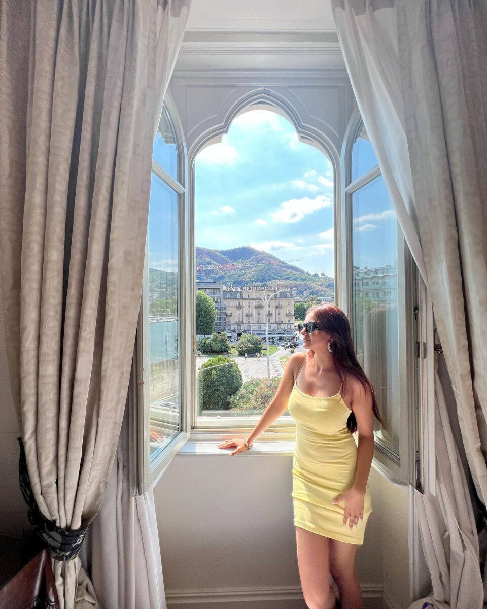 Anushka Sen, yellow mini dress, ornate arched window, SD Phone Wallpaper