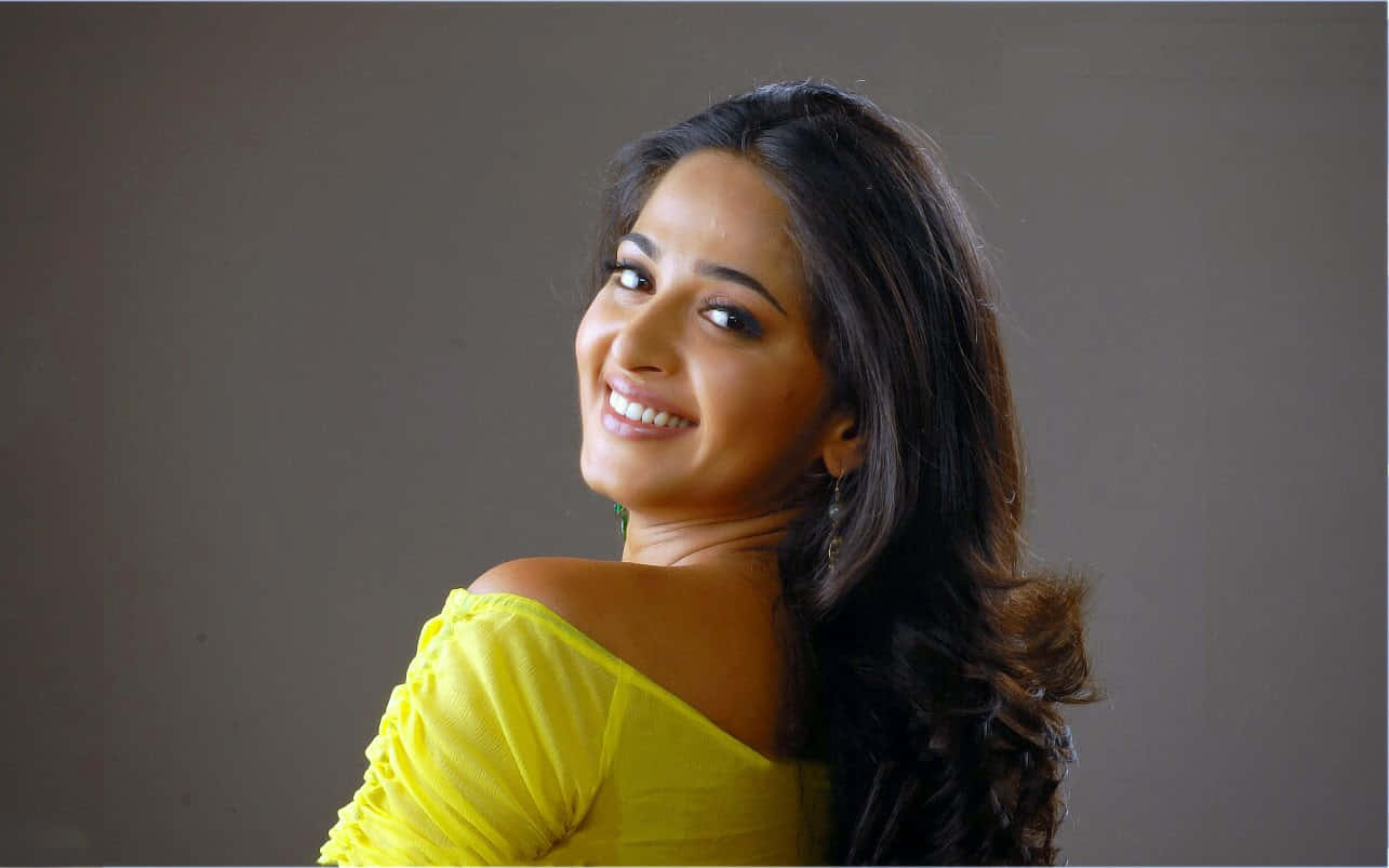 Anushka Shetty, yellow off-shoulder top, long dark hair, HD Desktop Wallpaper