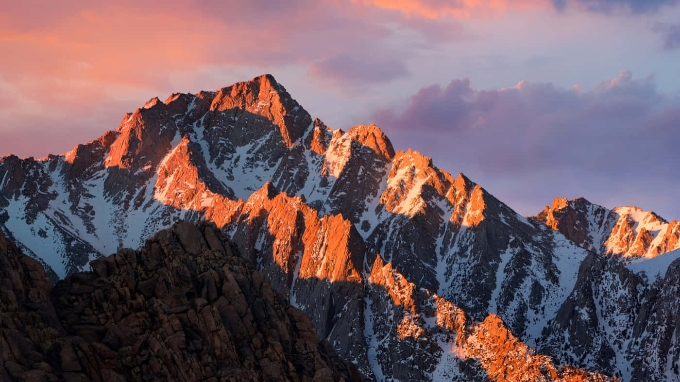 Apple Desktop, snowcapped mountain peaks, warm orange light, HD Desktop Wallpaper