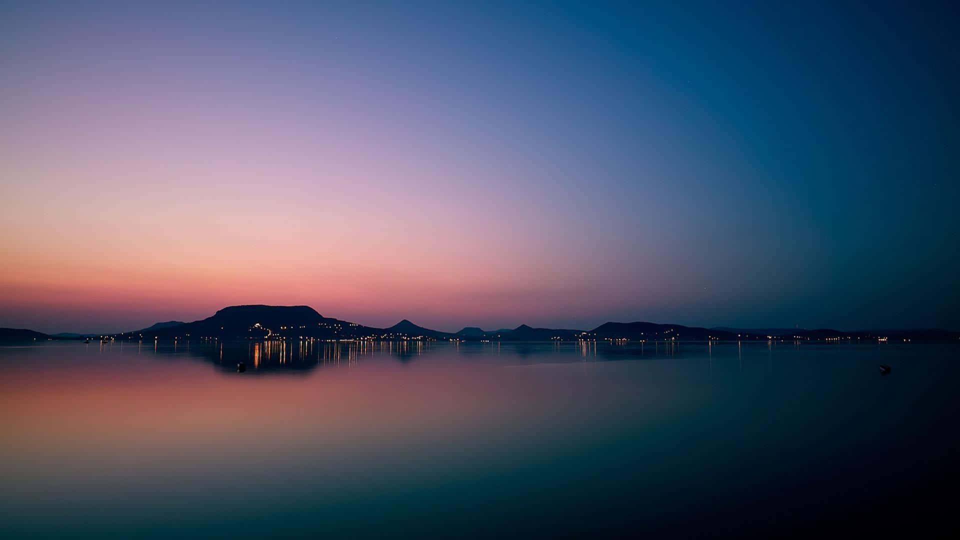 Apple Mac Desktop, twilight lake, glowing city lights, Full HD Desktop Wallpaper