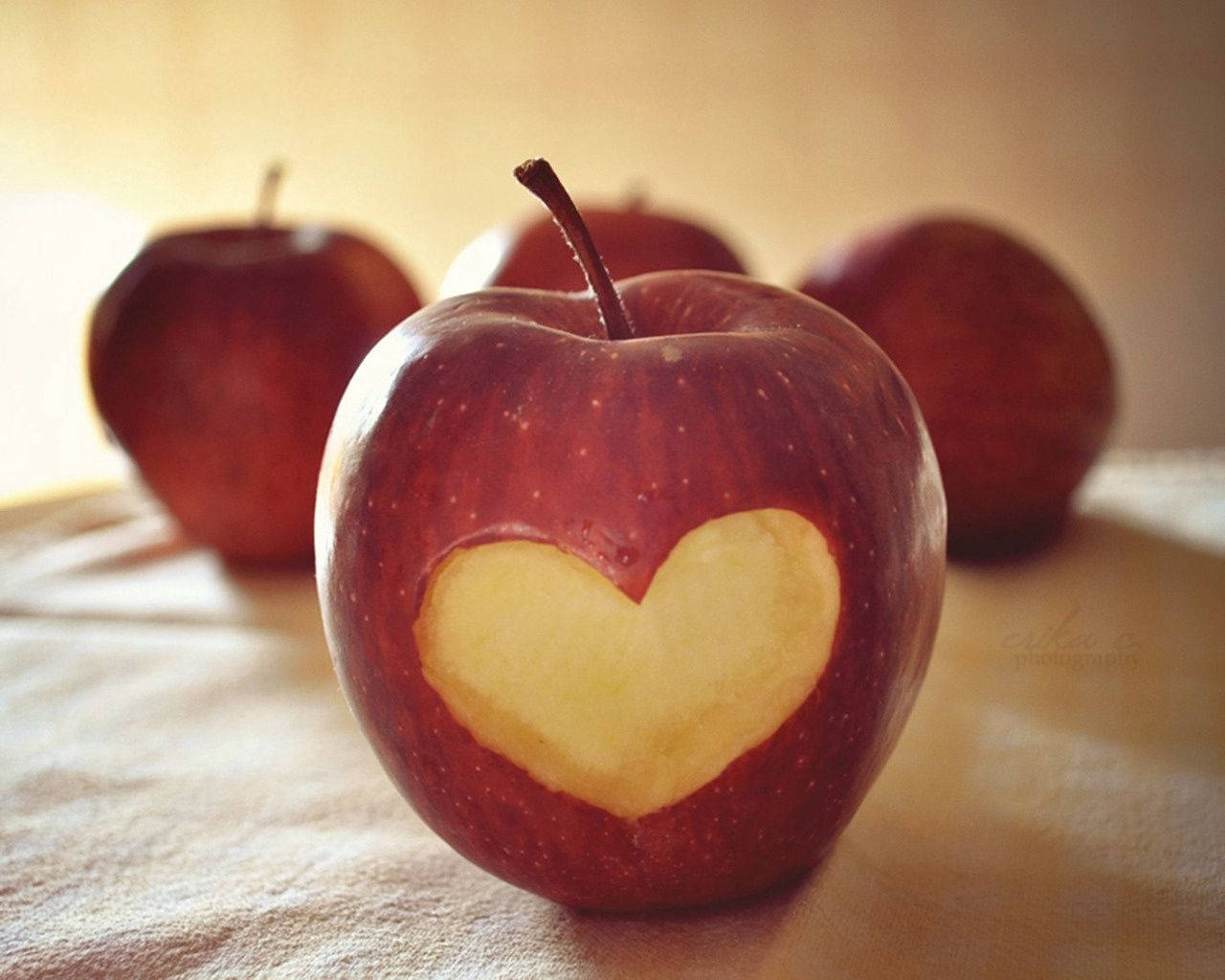red apple, heart-shaped core cutout, textured surface, HD Desktop Wallpaper