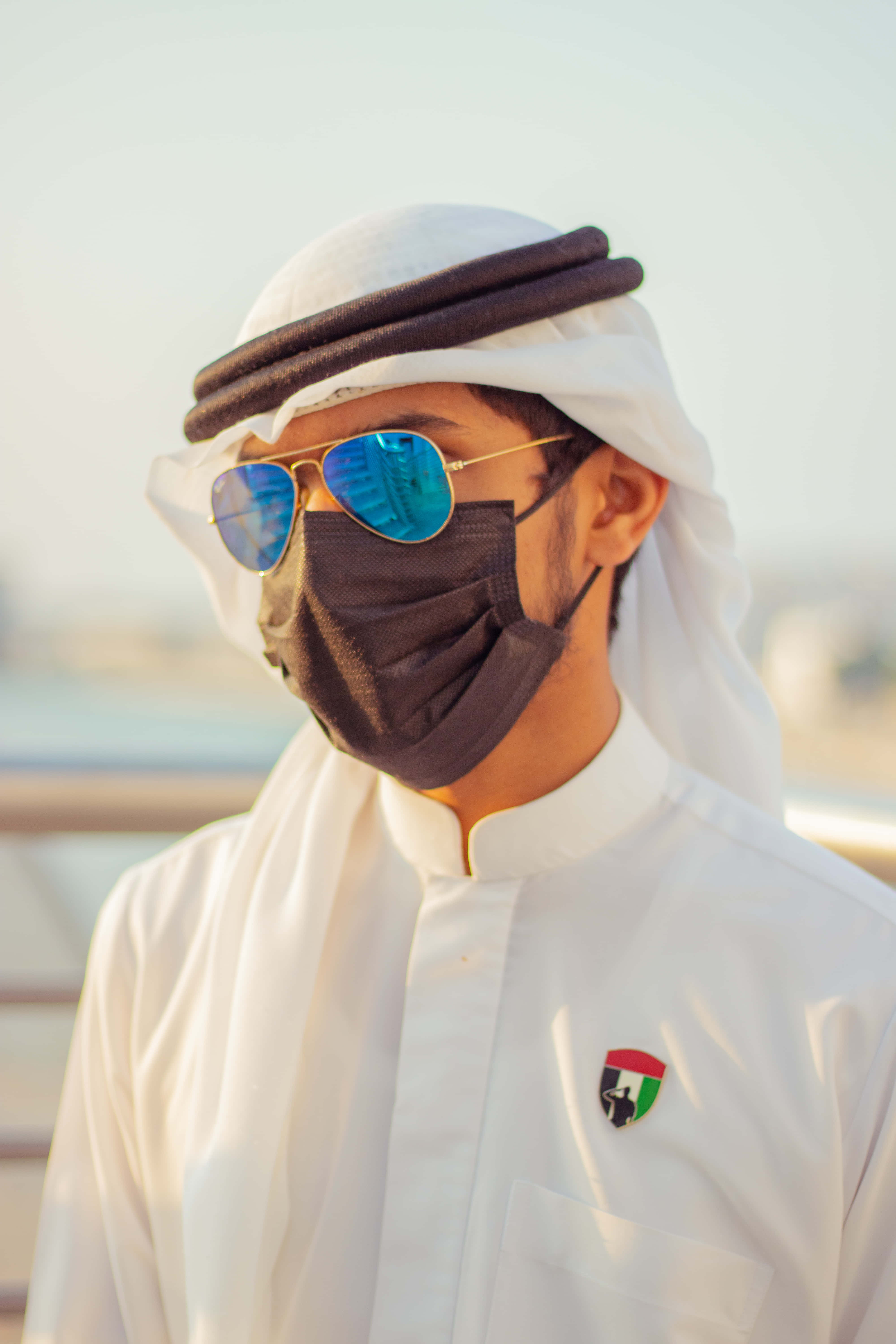 Arab man, blue sunglasses, traditional Emirati attire, 5K Phone Wallpaper