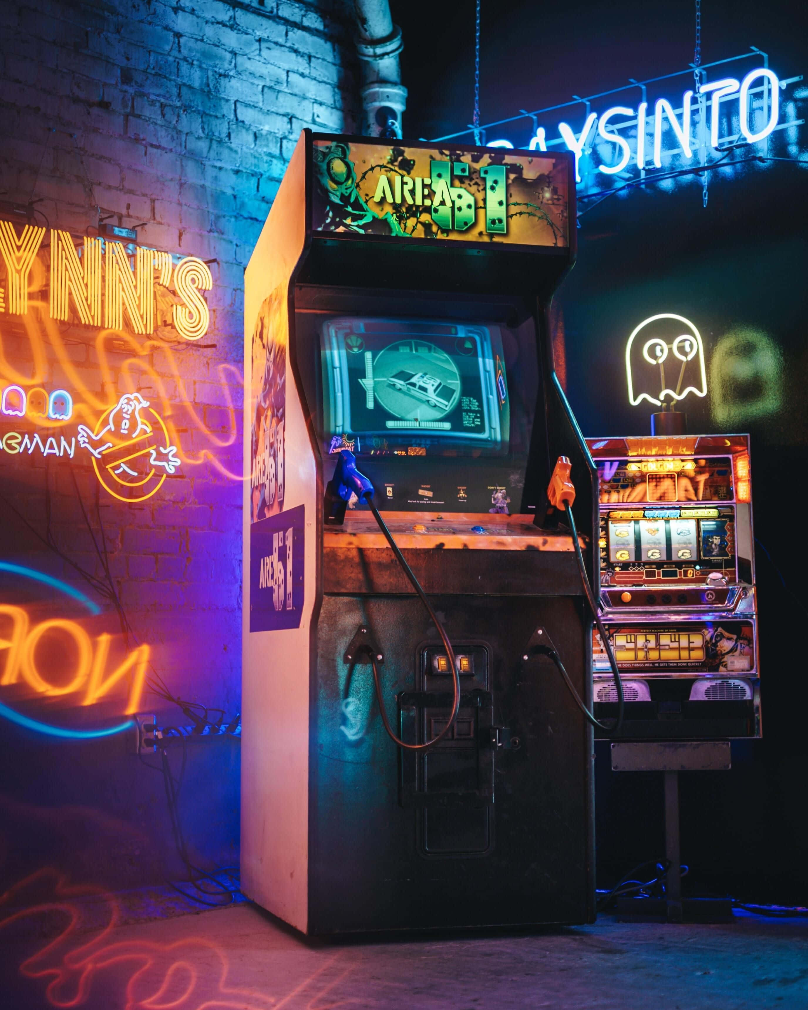 vintage arcade machine, neon signs, gritty urban alley, 2K Phone Wallpaper