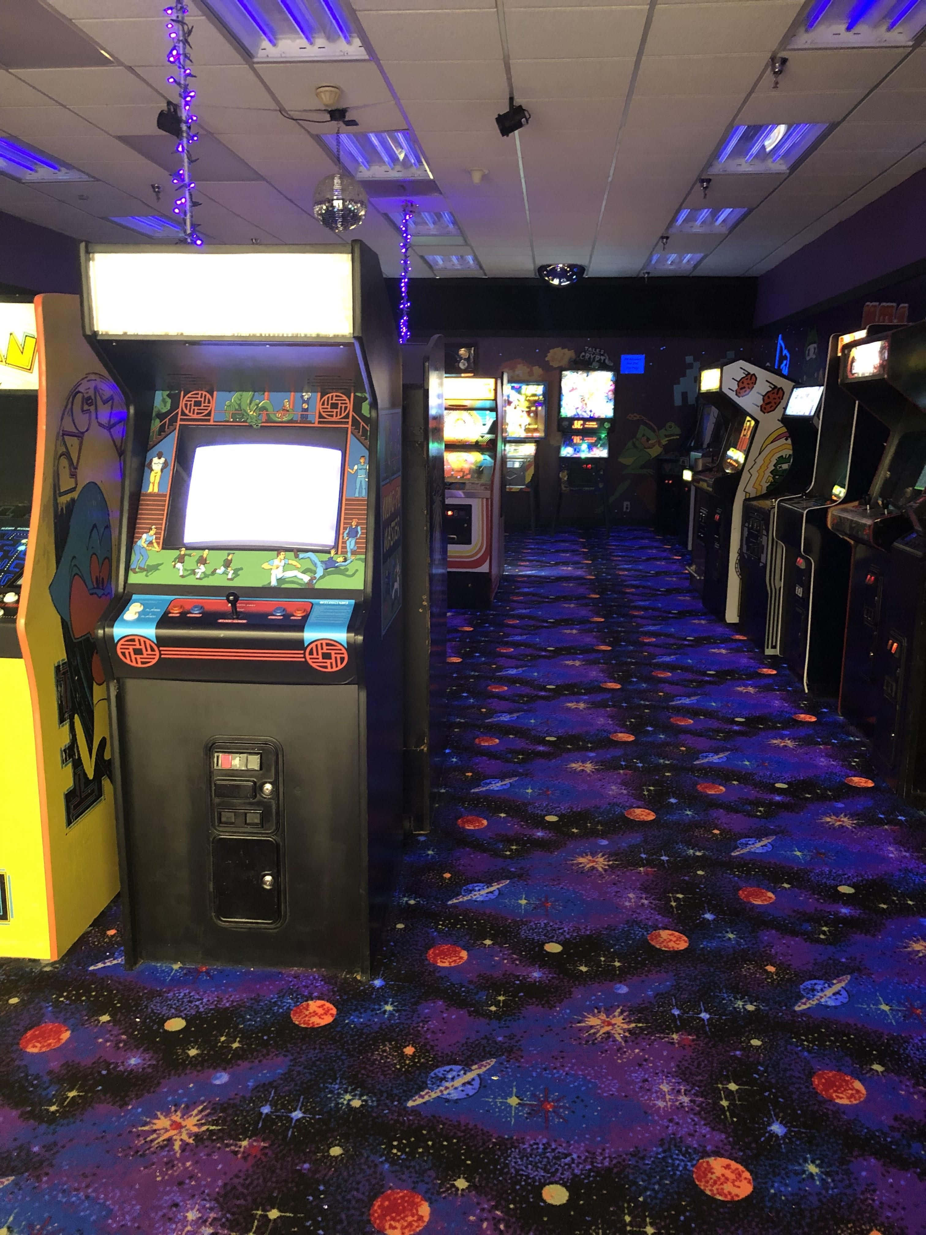 arcade machines, purple carpet, neon lights, 4K Phone Wallpaper
