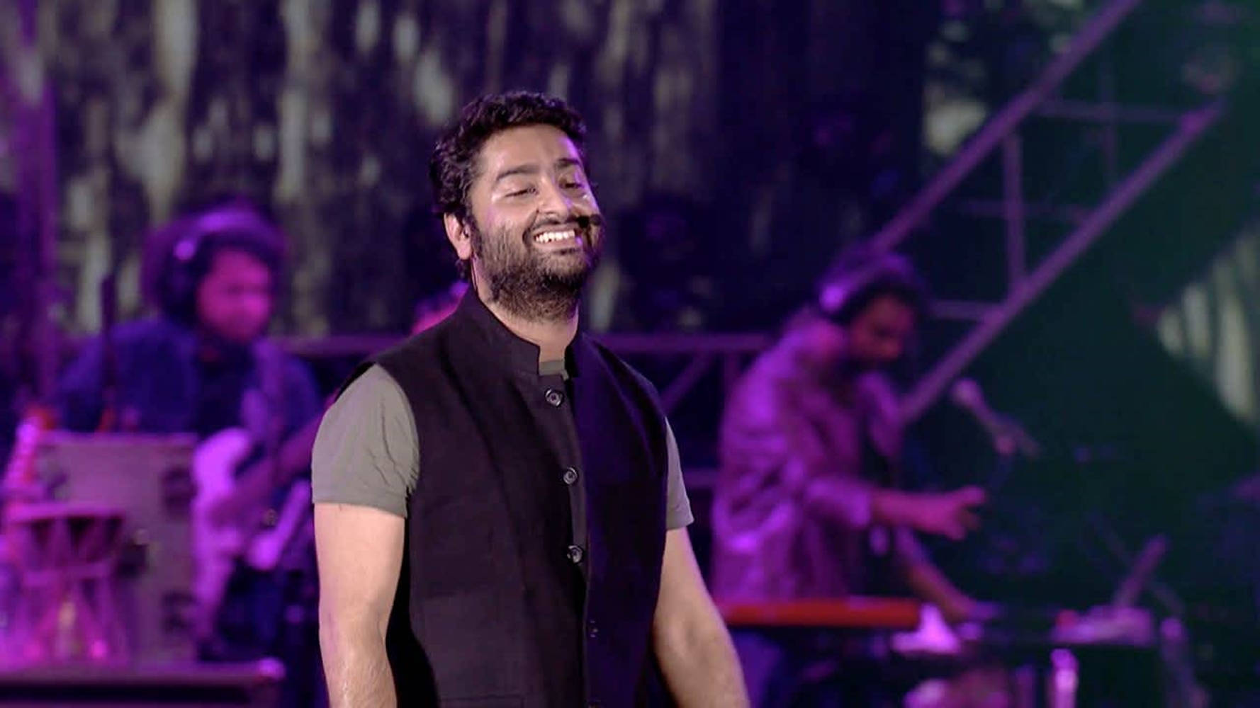 Arijit Singh, purple-lit stage, bearded man, HD Desktop Wallpaper
