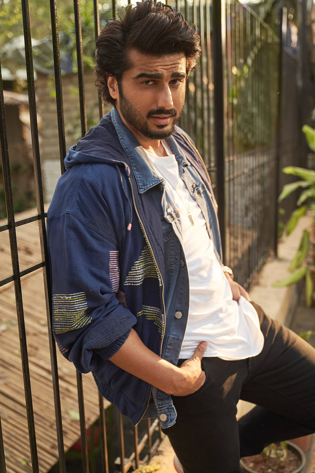 Arjun Kapoor, black metal fence, warm sunlight, HD Phone Wallpaper