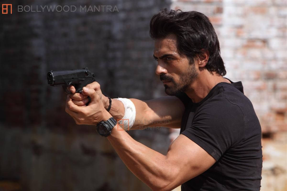 Arjun Rampal, black handgun, weathered brick wall, SD Desktop Wallpaper