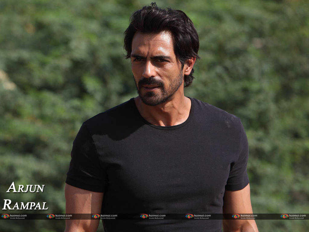 Arjun Rampal, black t-shirt, blurred green foliage background, SD Desktop Wallpaper